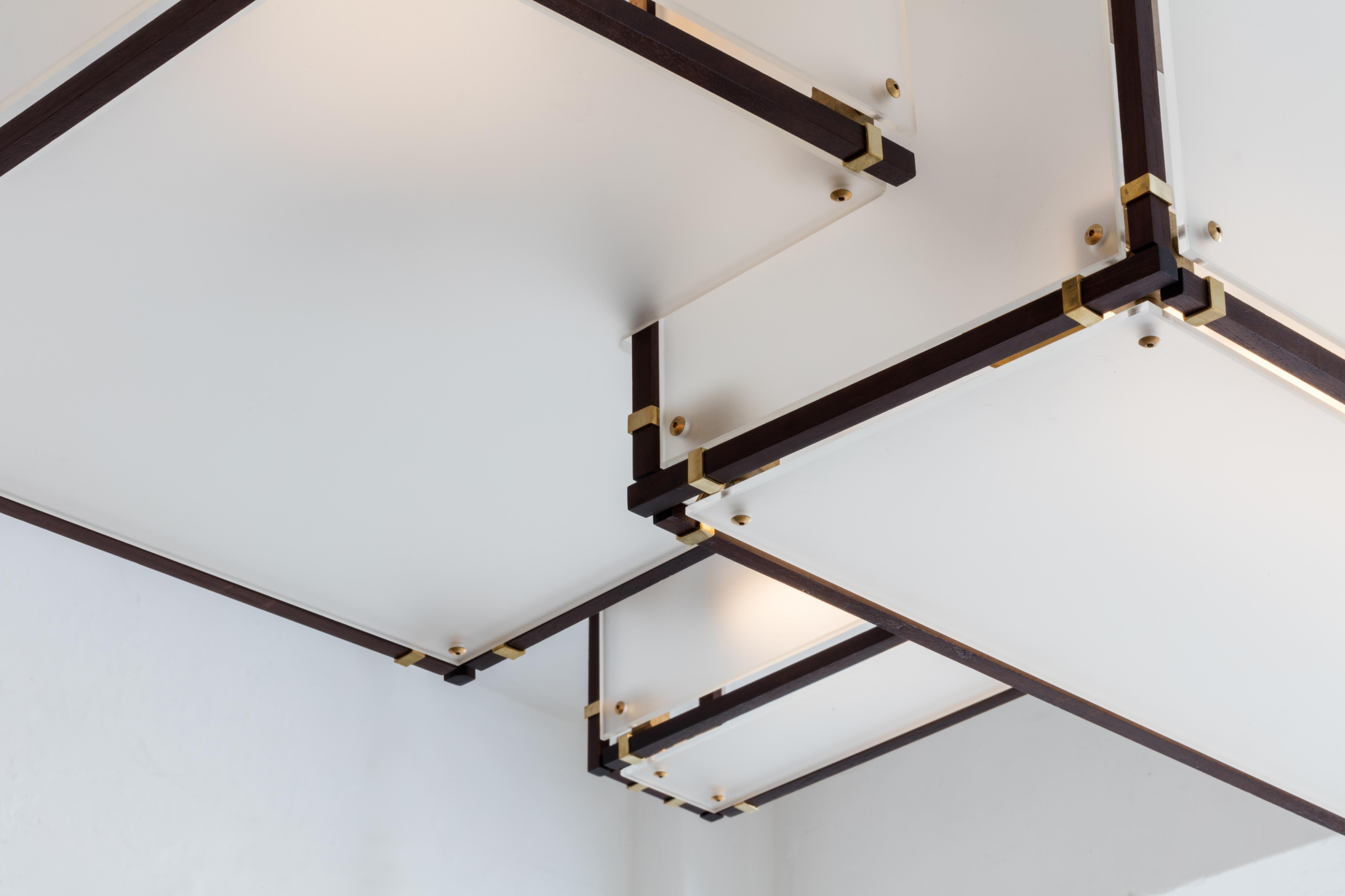 Measurements 47 W x 36 D x 56 H inches
Minimum Drop Length: 56 inches. 
Canopies: 6 W x 1.75h inches. 
Weight: 70 lbs

Materials
Metal: Brushed brass, blackened brass, bronze, brushed nickel
Frame: Blackened oak, bleached oak, walnut, white