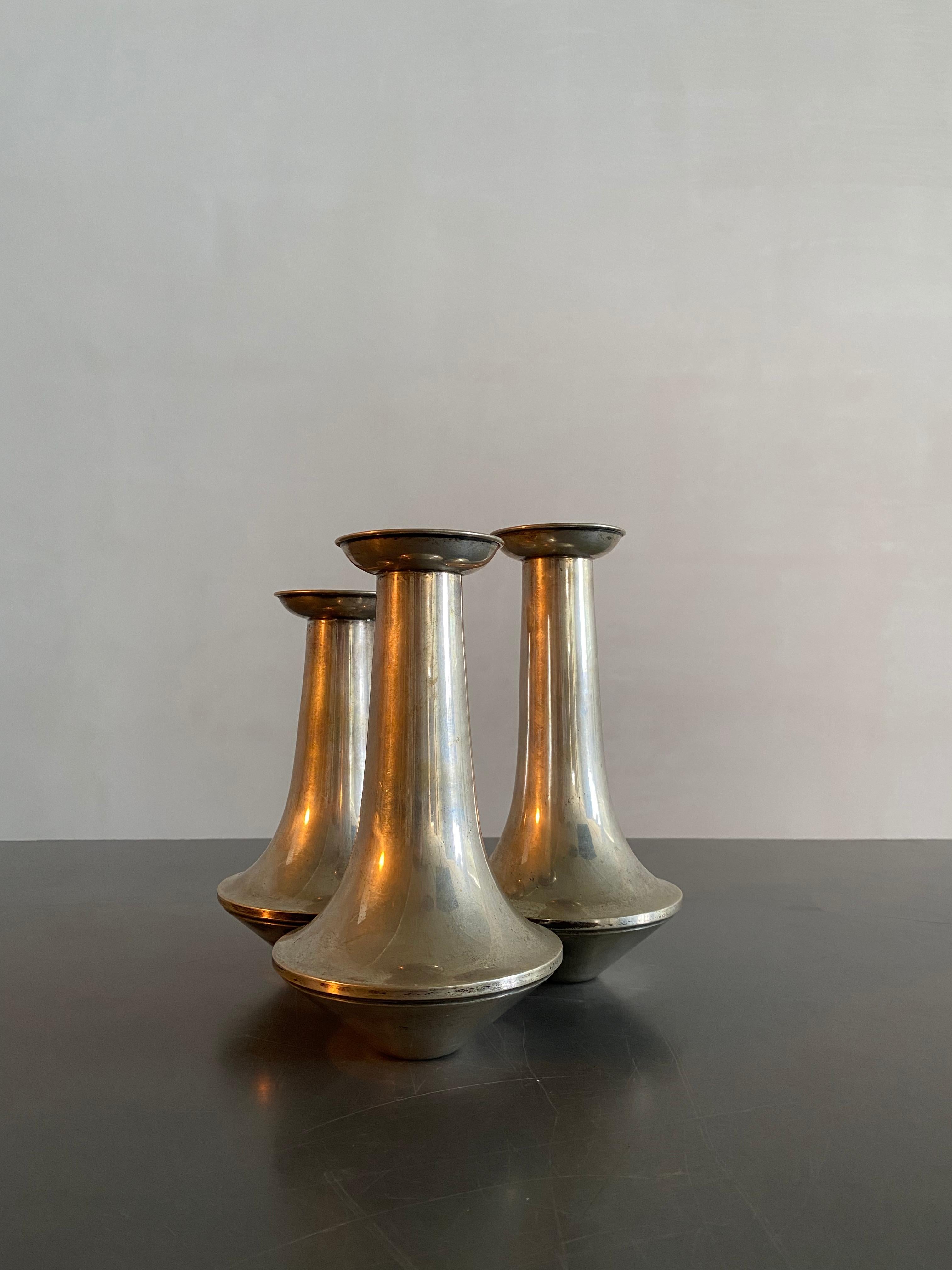 Three joined silver plated vases. All three have a slight difference in height for a beautiful flower arrangement.