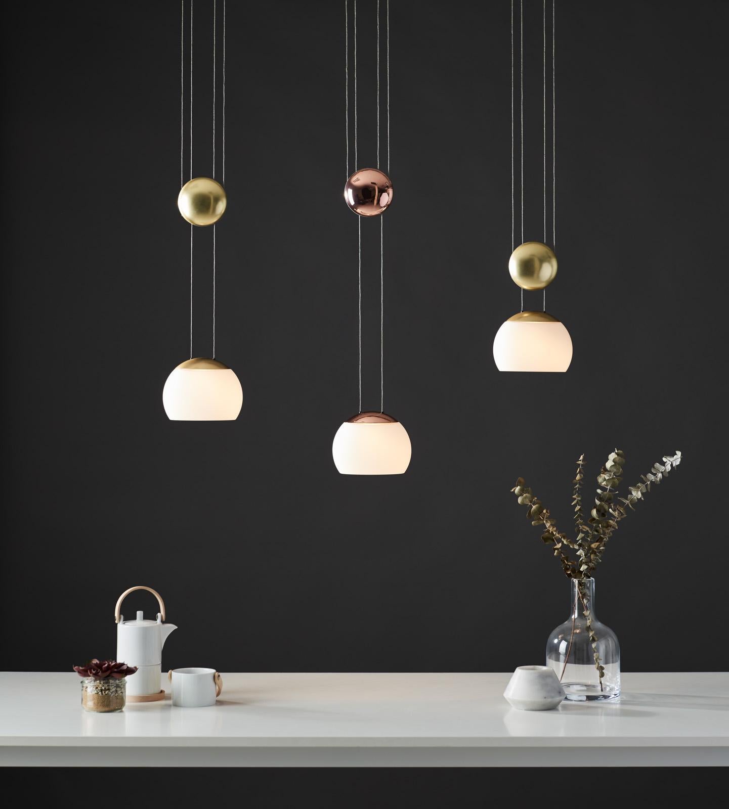 With and adjustable height shade inspired by the movement of a Yo-Yo, the JOJO LED Pendant is a traditional shape with modern sensibilities. Lit with an LED bulb, the JoJo casts a gentle, calm illumination through the mouth-blown opal