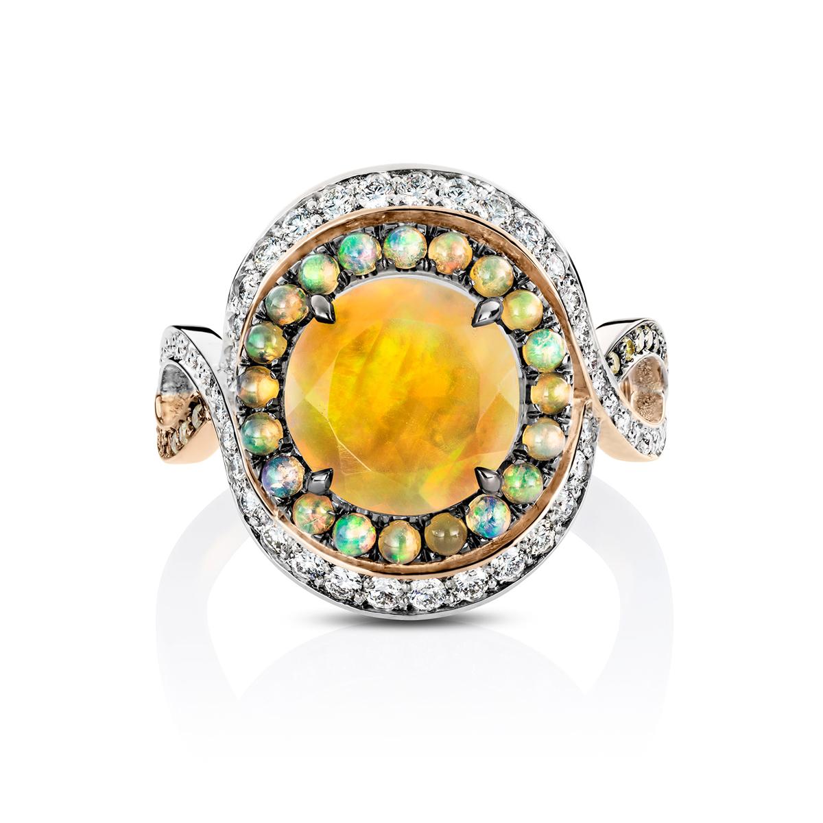 One of a kind ring in 18K Rose & White gold 6,4 g set with an Athiopien opal, Athiopian opal cabochons, white diamonds, natural yellow icy diamonds. Total carat diamonds: 0,66ct. Measurement of the centerstone with surounding stones 17,46 x 14 mm.