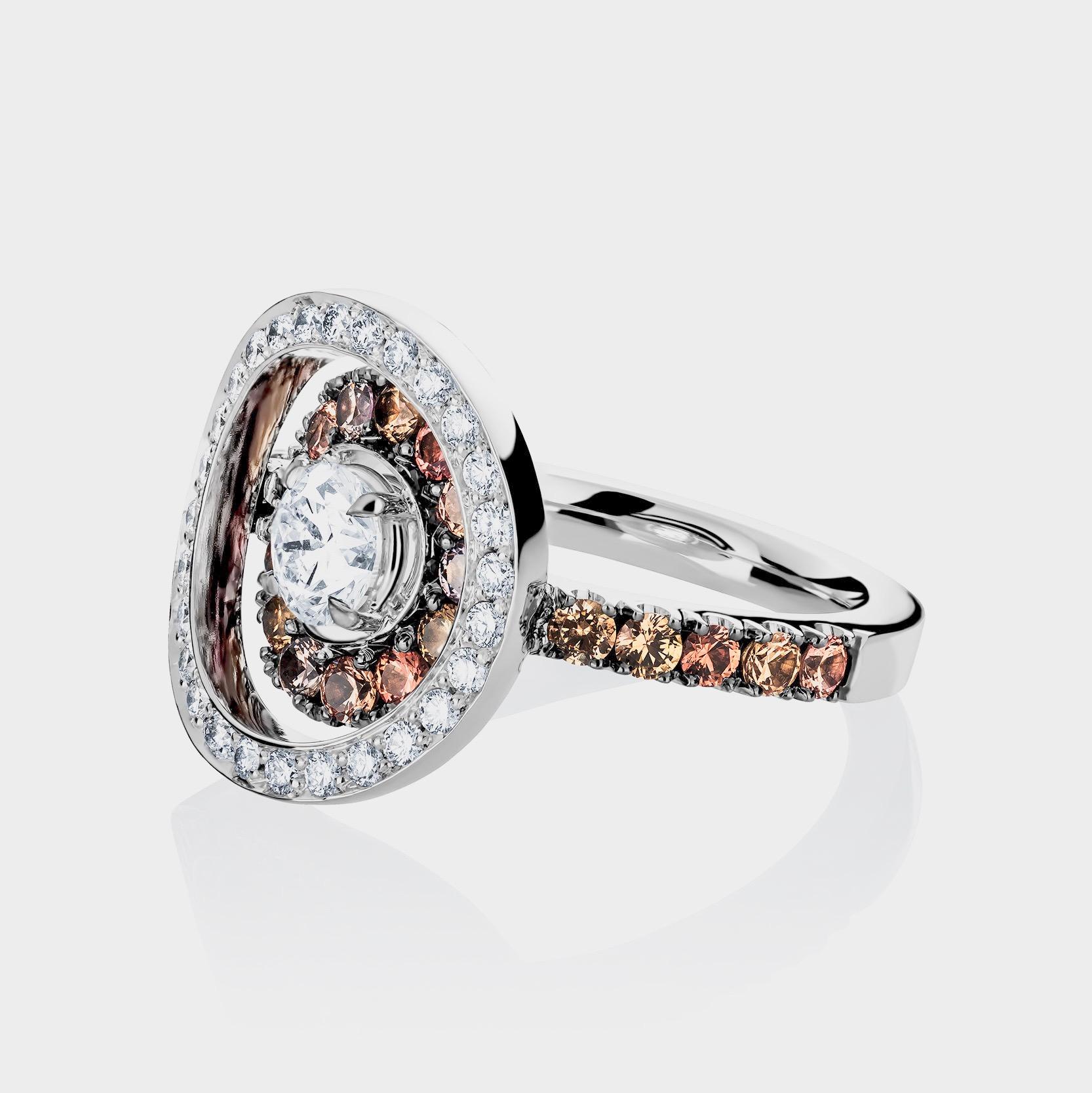 Ring in 18K White gold 7,3 g set with a white diamond brilliant-cut centerstone HVS 0,53 ct., white DEGVVS diamonds 0,738 ct., Skin Coloured Saphires 0,92 ct. . Handmade the traditional way. size EU 54,5, US 6,75. This exquisite product comes from