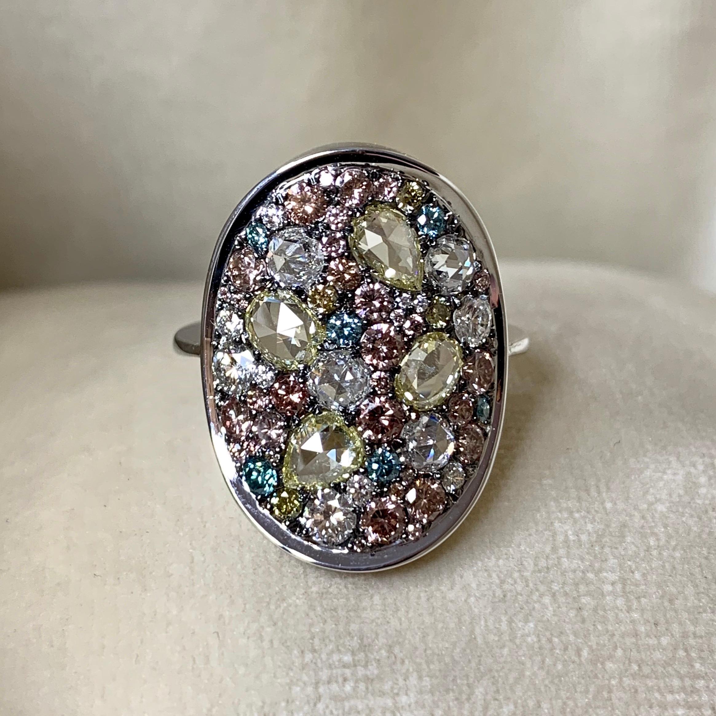 One of a kind ring in 18K white gold 6,4 g & blackened sterling silver (The stones are set on silver to create a black background for the stones)
Set with Fancy yellow & white rose-cut diamonds, Fancy chocolate pink, yellow, white DEGVVS,  Natural