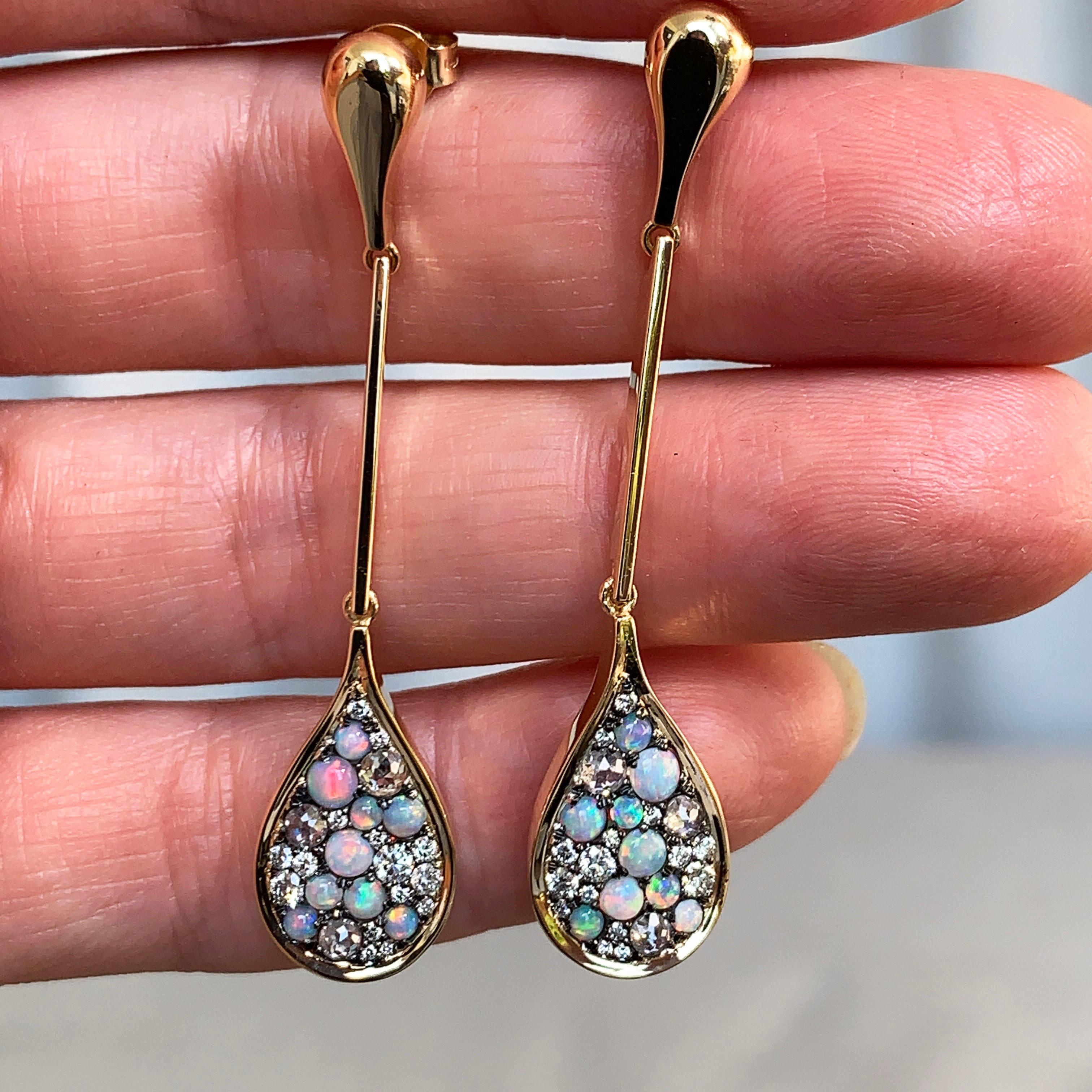 One of a kind earrings handmade in Belgium by jewelry artist Joke Quick, in 18K yellow gold 10 g & blackened sterling silver 3g (The stones are set on silver to create a black background for the stones) Pave set with Australian white opal cabochons,