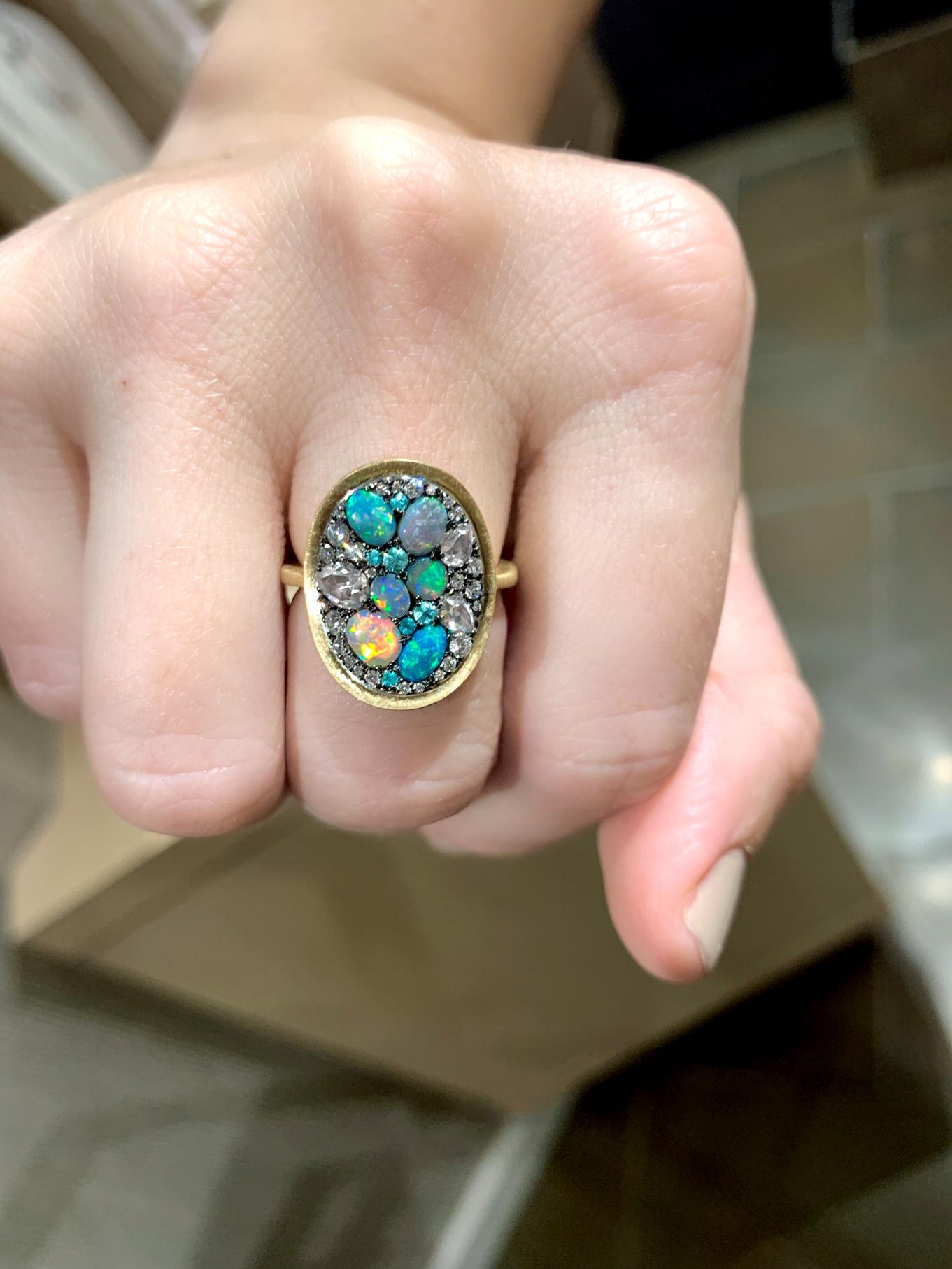 One of a kind Starstruck Ring handmade in Belgium by jewelry artist Joke Quick in matte-finished 18k yellow gold and blackened sterling silver featuring six exceptional Australian lightning ridge black opal cabochons totaling 1.09 carats, six