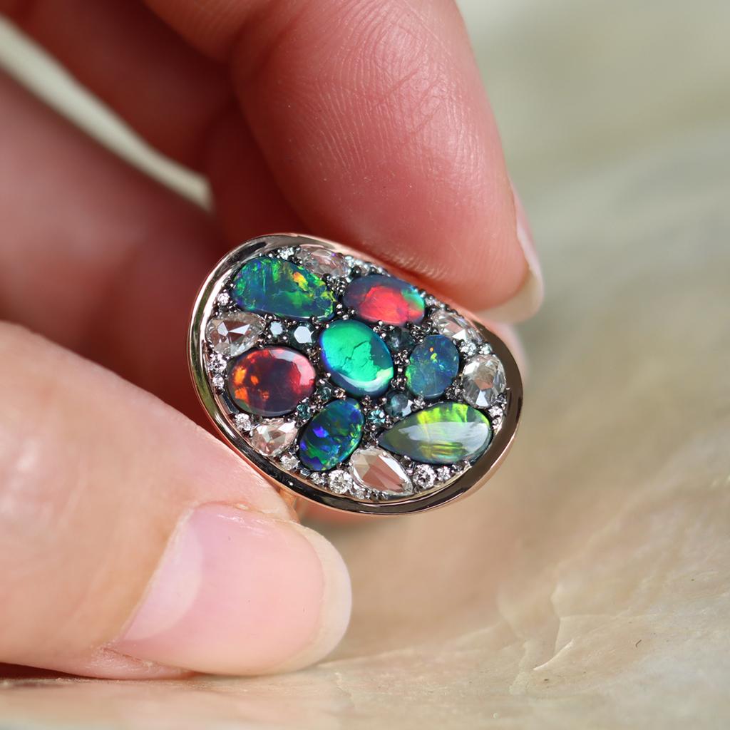 Only for Opal lovers....
One of a kind ring handmade in Belgium by jewellery artist Joke Quick.  Diamonds and gemstones in different cut shapes and colours are set like a mosaic. Handmade the traditional way, no casting or printing envolved.   
Ring