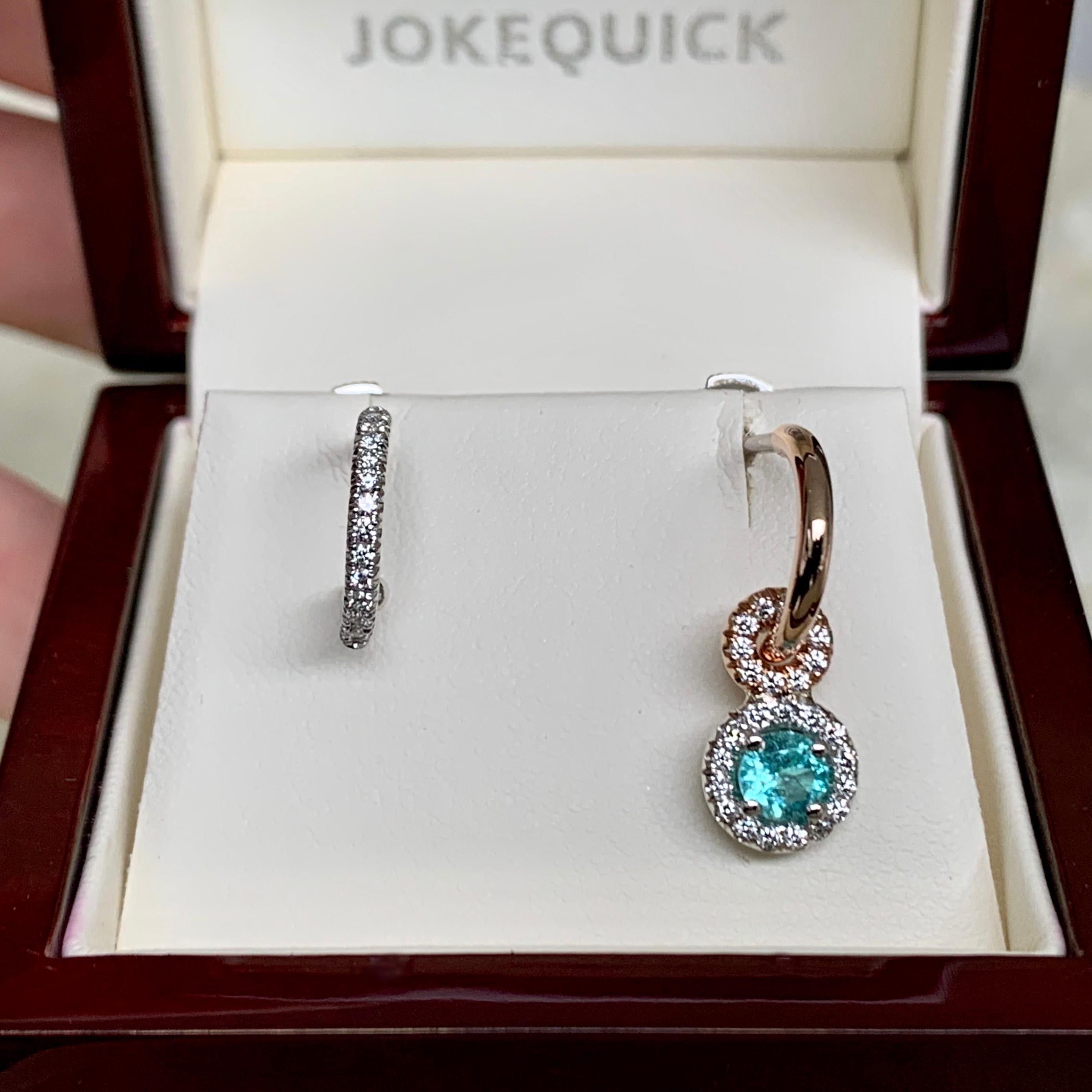 Mismatched Hoop earrings handmade in Belgium by jewelry artist Joke Quick, in solid 18K rose & white gold and handmade the traditional way ( no casting or printing involved ).
One of the two hoop earrings is made in White gold and set with White