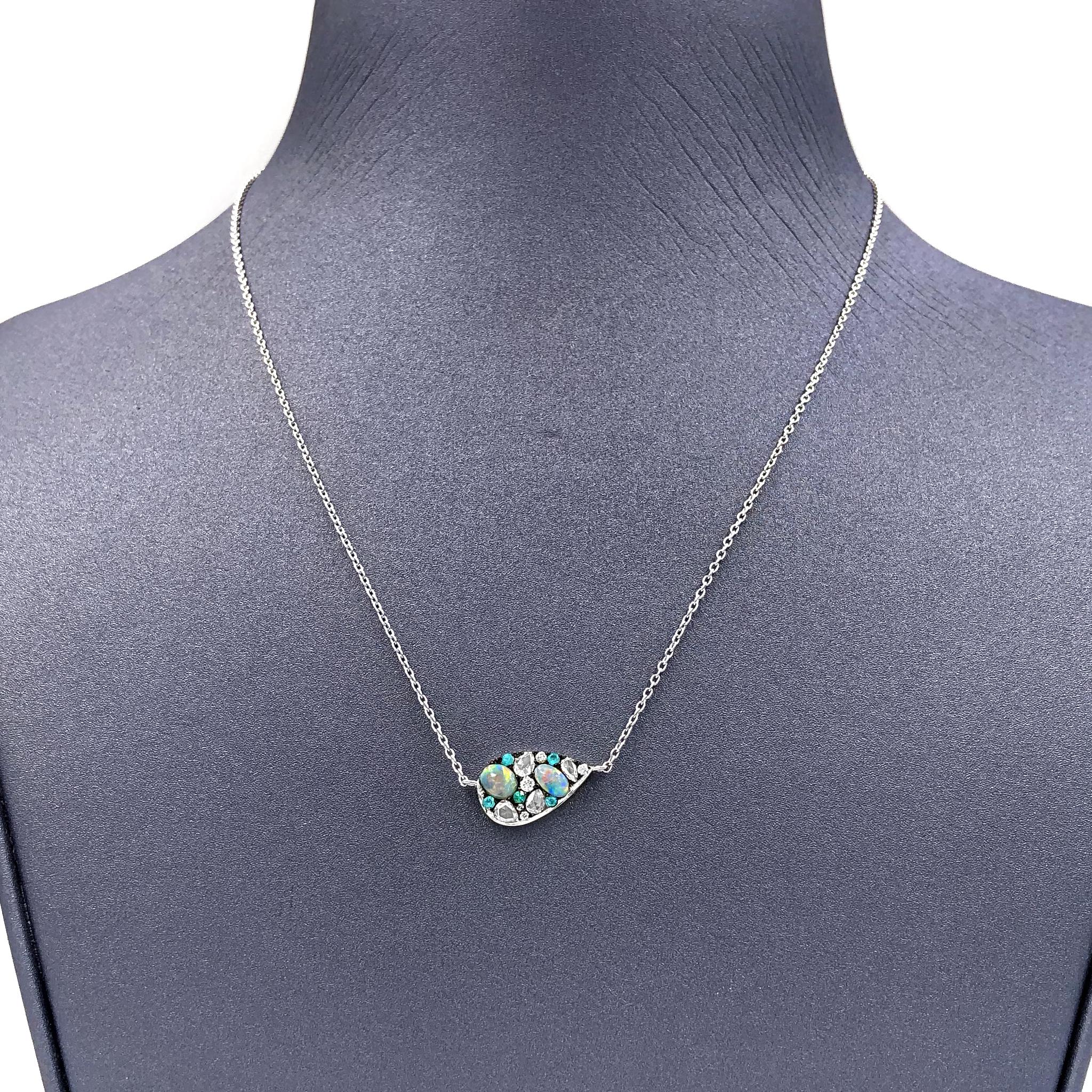 One of a Kind Floating Starstruck Necklace handmade in Belgium by jewelry artist Joke Quick in high-polished 18k white gold featuring with 0.46 total carats of Australian Lightning Ridge black opal, Paraiba tourmaline totaling 0.07 carats, 0.07