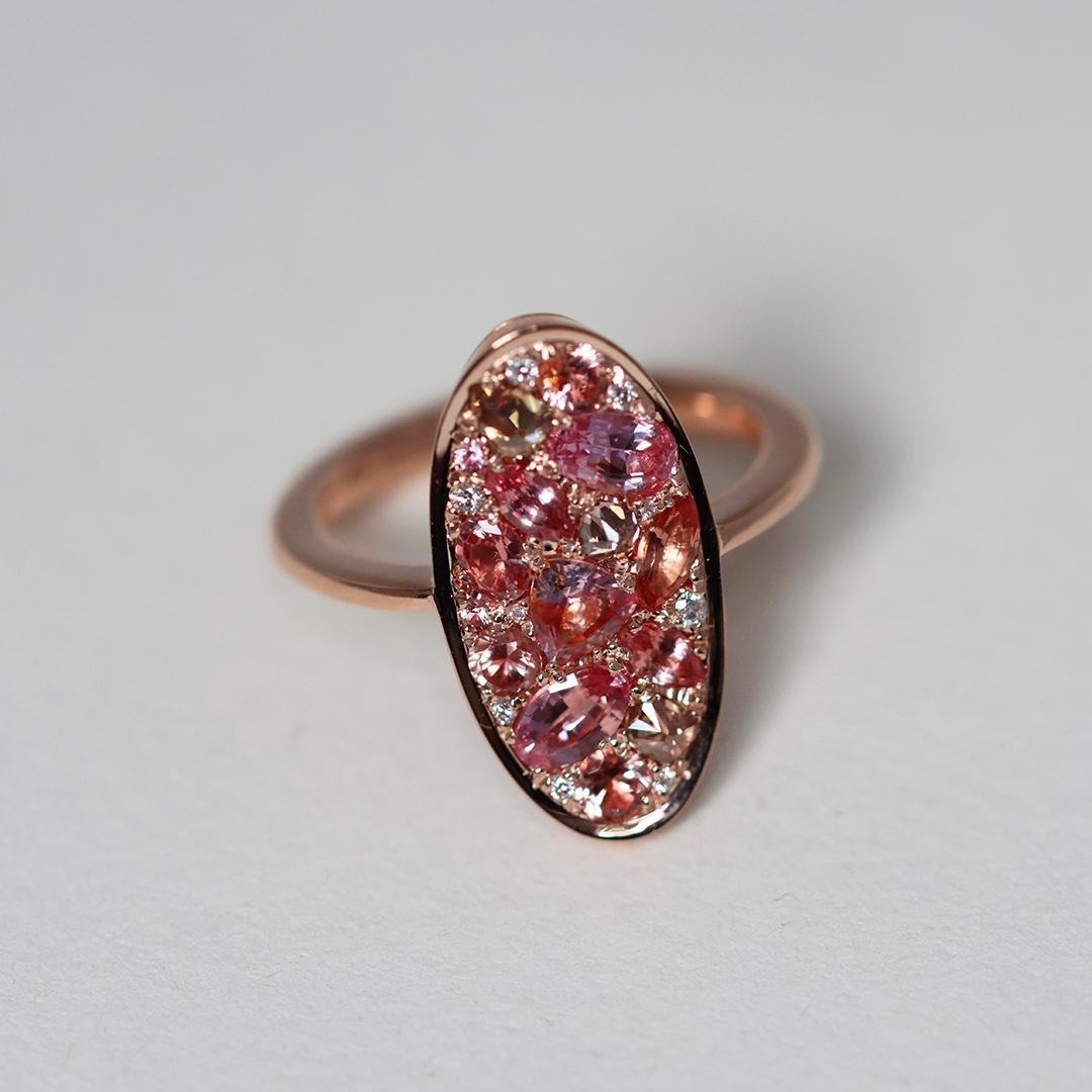 Blushing lotus-pink hues come to life in this comfortable one-of-a-kind ring, Pink Poetry. Crafted in 18K rose gold, this ring radiates warmth and elegance with its unique curved design that hugs your fingers contour.

Handmade in Belgium, with no