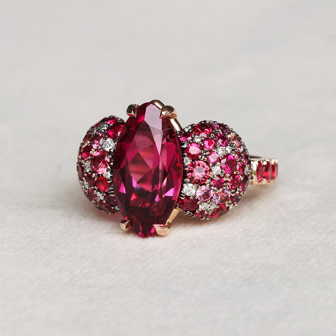 Dive into the depths of red with this one of a kind ring handmade in Belgium by jewellery designer Joke Quick, with no casting or printing involved.

This exceptional piece features a marquise shape Rubellite Tourmaline as its centerpiece,