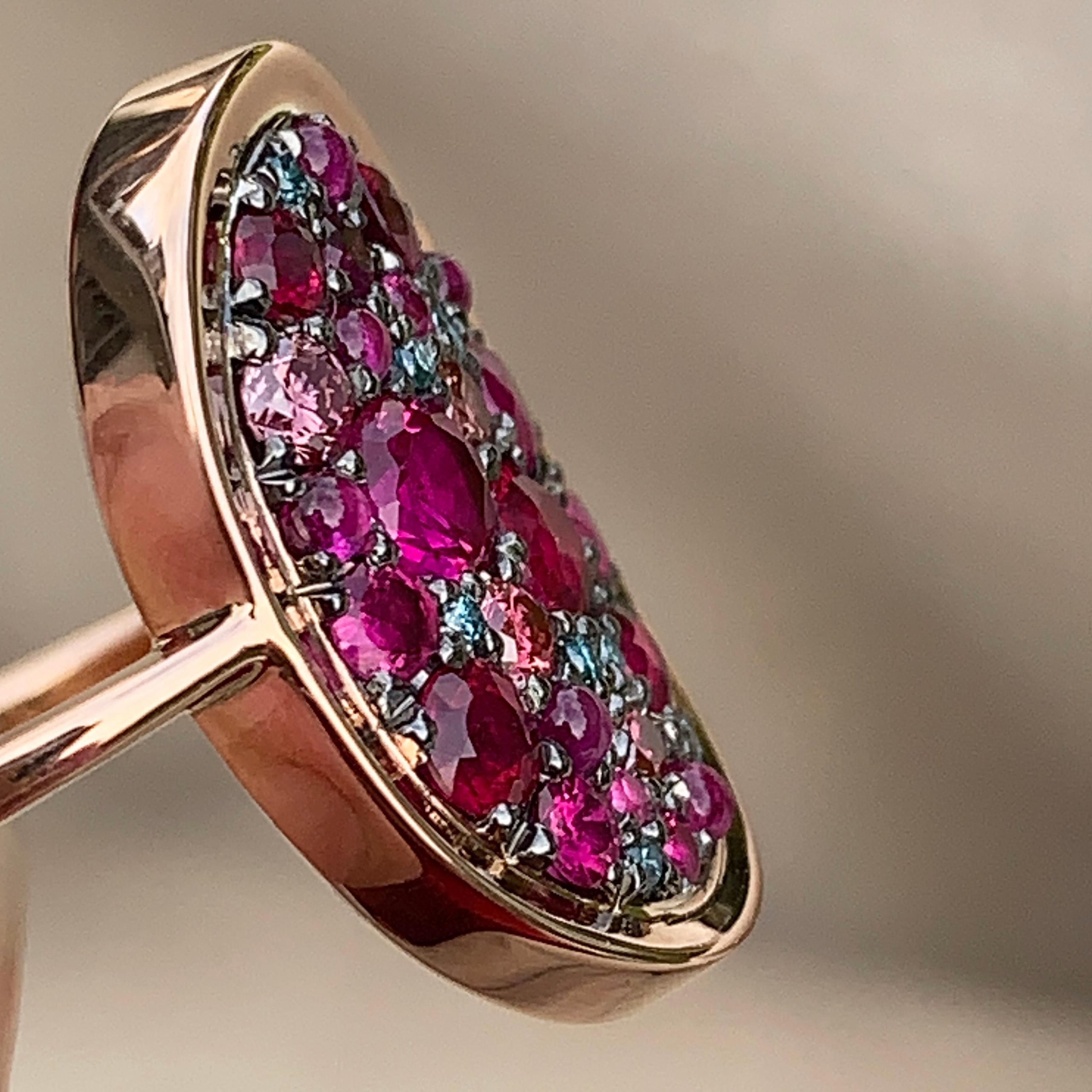 One of a kind ring in 18K rose gold 4,7 g & blackened sterling silver (The stones are set on silver to create a black background for the stones) Pave set with brilliant-cut rubies 0,80 ct. , pink sapphire cabochons, 0,13 ct. Natural colored pink