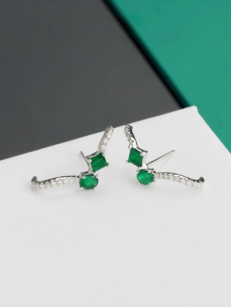 Combination of micro pave diamond and emerald cuff earring, all with a high polish finish. Available in 18K White Gold.

Earring Information
Diamond Type : Natural Diamond
Metal : 18K
Metal Color : White Gold
Diamond Carat Weight : 0.20ttcw
Emerald