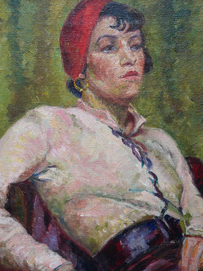 This striking Art Deco portrait oil painting is by female artist Jolan Polatschek Williams. Williams was born in Austria but settled in England in the 1920's where she remained. Painted in 1934 it is a Post Impressionist seated portrait of a dark