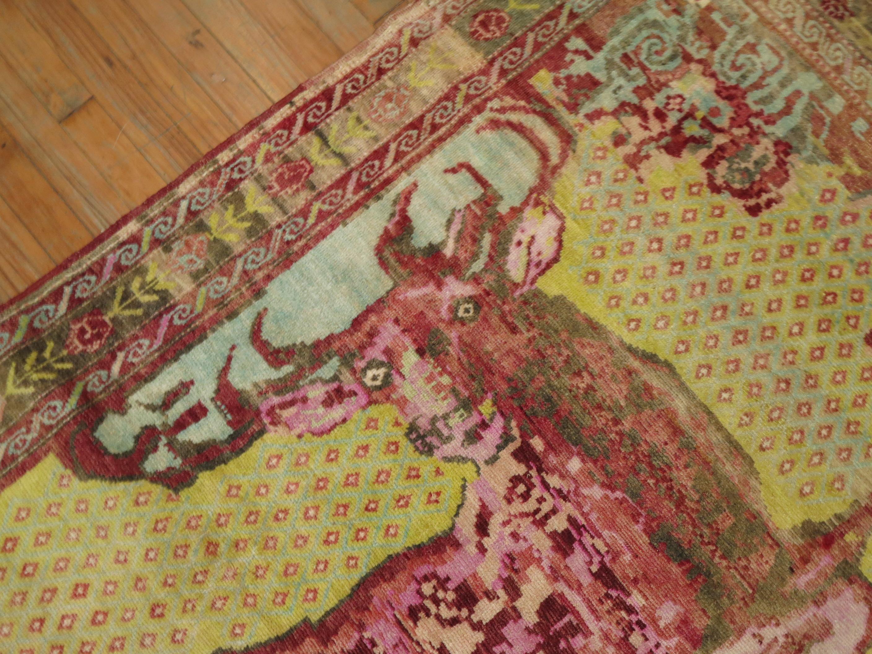 An early 20th century Russian Karabagh pictorial rug depicting a pleasant deer on a mustard yellow ground

Measures: 4'1'' x 7'9''.