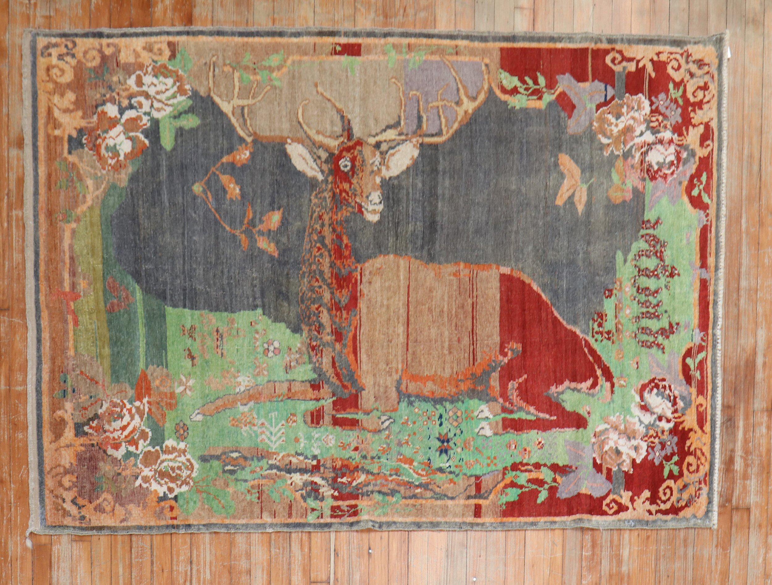 An early 20th-century high-quality Russian Karabagh pictorial rug depicting a happy go luck deer

Measures: 4'5'' x 6'9''.