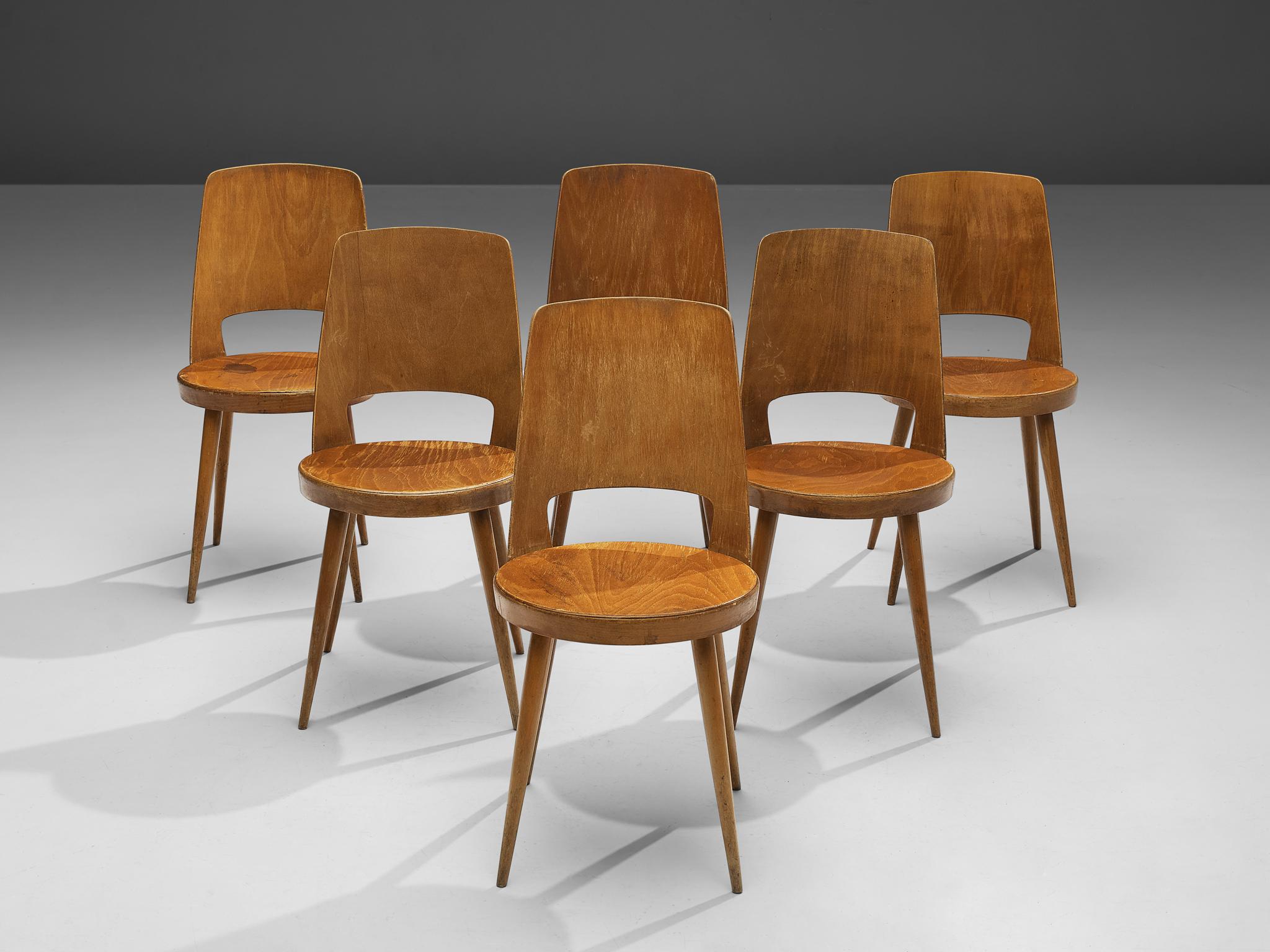 Jomaine Baumann, large set of 'Mondor' dining chairs, plywood, wood, France, 1960s

The ‘Mondor’ dining chair was manufactured by French furniture maker Jomaine Baumann. Characteristic for the ‘Mondor’ chair is the curved bentwood back with a