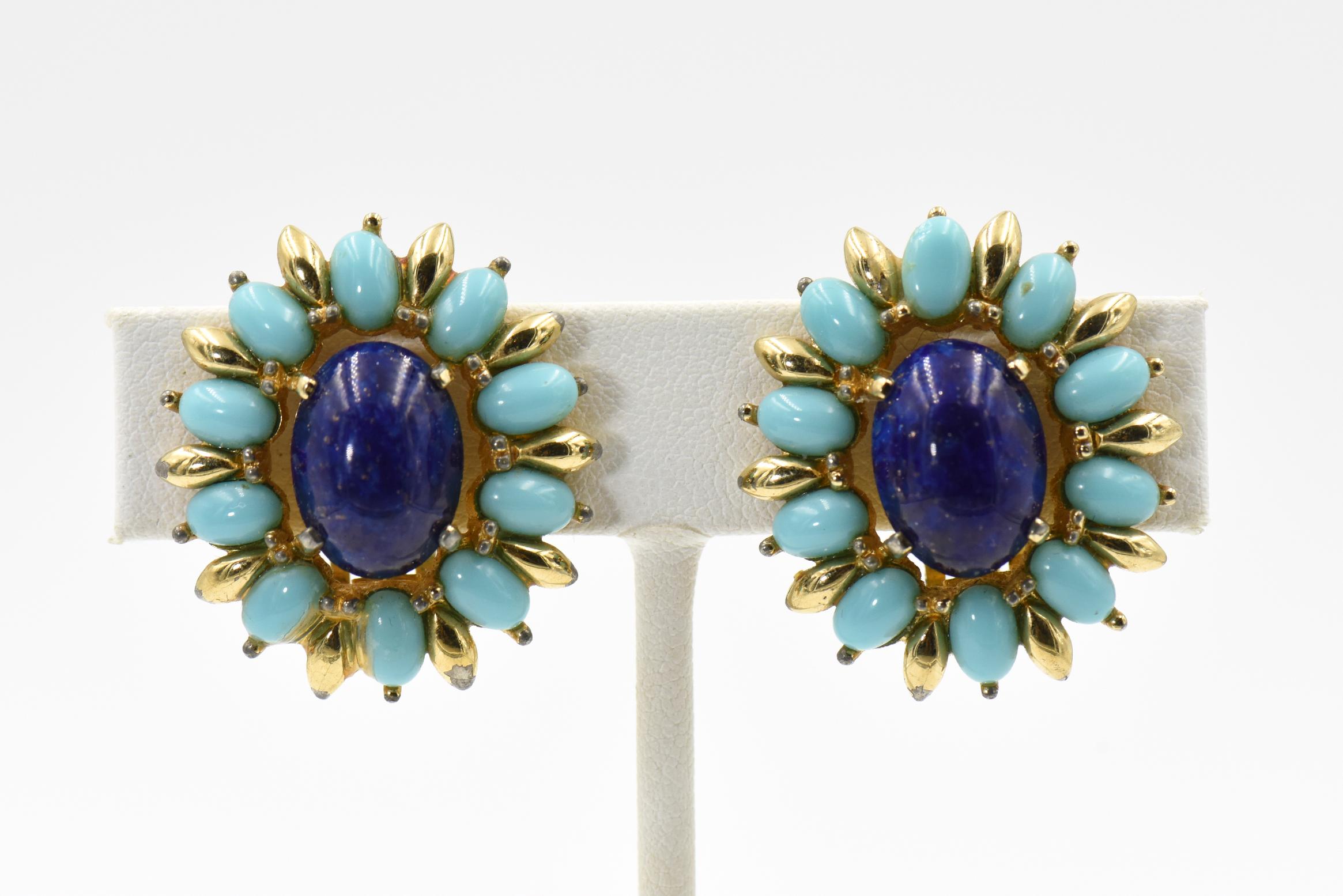 Mid 20th Century Jomaz clip on earrings featuring simulated lapis lazuli cabochon set in a faux turquoise and gold tone divider frame. 
Signed Jomaz