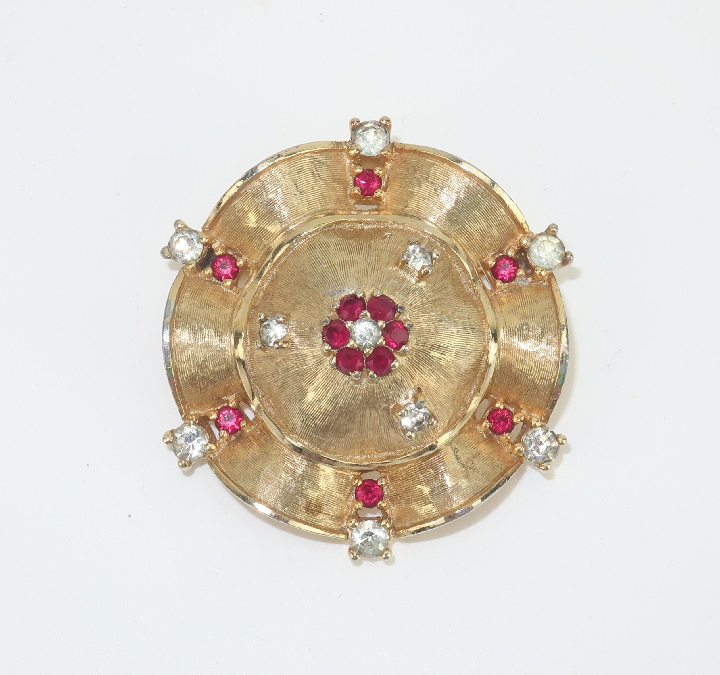 Jomaz put the fabulous in faux with their lovely costume jewelry creations that mirror the quality and style of fine jewelry.  This gold tone brooch is a modest size with an elegant quality that will garner second glances and admiring looks.  The