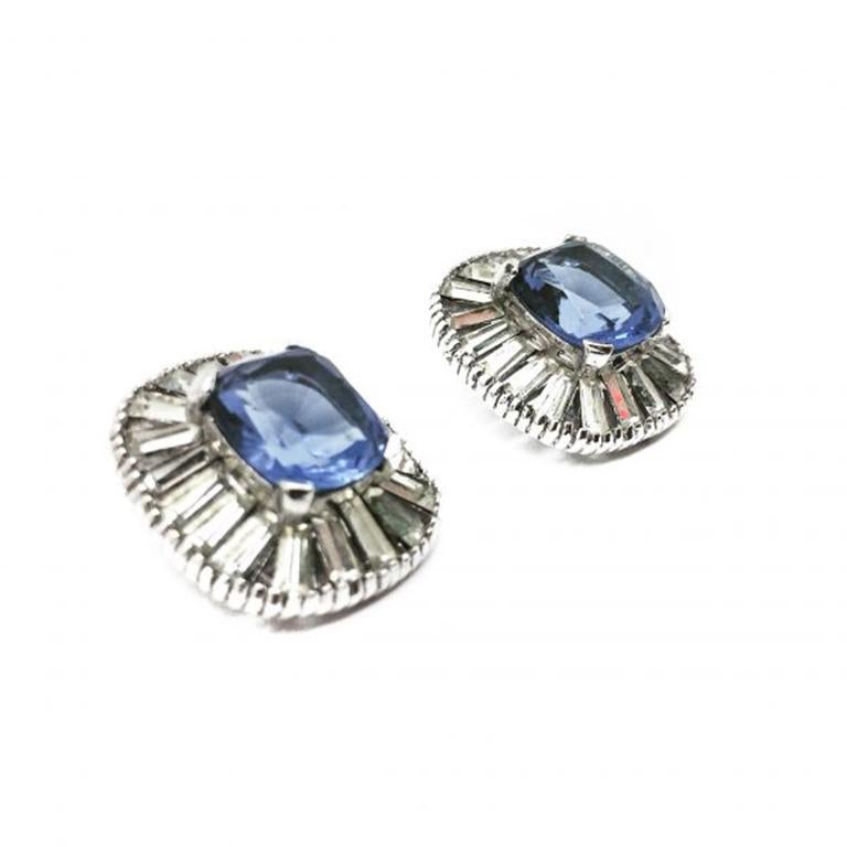 Fabulous Vintage late 1940s JOMAZ Deco Style Earrings. Oozing deco style. Featuring the most wonderful pool of blue faceted crystal for a central stone, surrounded by crystal tapered baguette stones in a rhodium plated setting. These vintage Jomaz