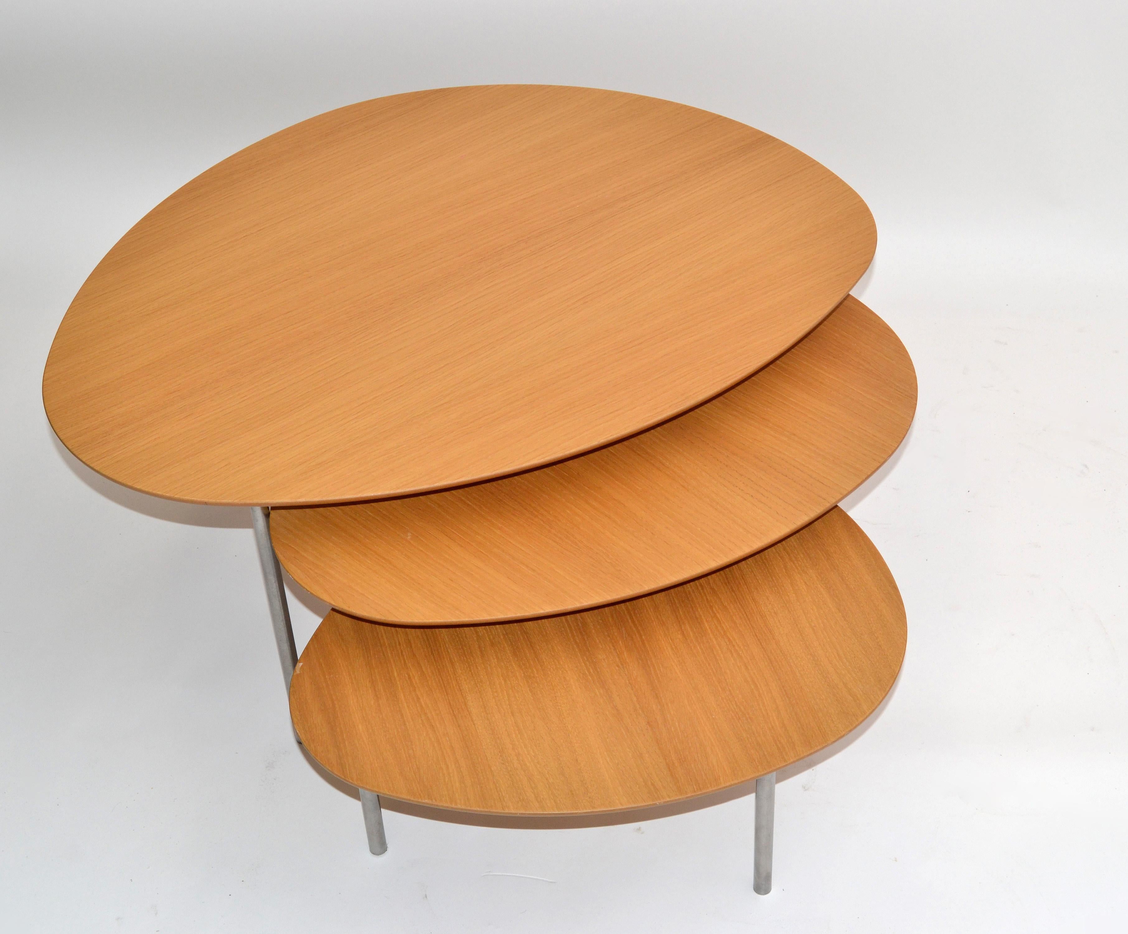 Set of 3 modern eclipse tan plywood nesting or stacking tables designed by Jon Gasca and made by STUA Design in Spain, 2009.
Steel legs can be easily unscrewed for shipping.
Measures: 22.0 D x 27.5 L x 12 inches H.
17.25 D x 21.75 L x 10 inches