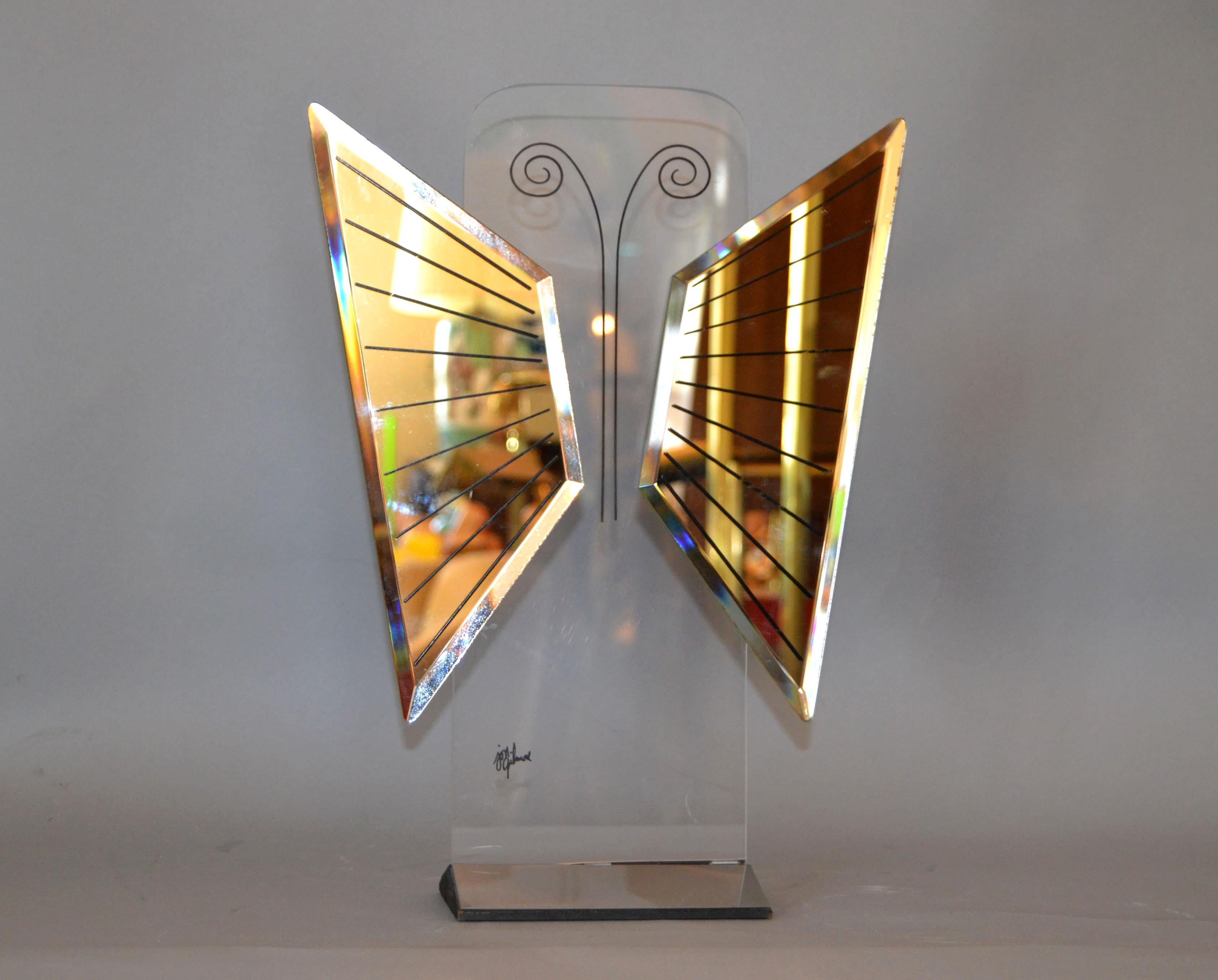 Unique Mid-Century Modern art mirror sculpture in chrome and Lucite shaped in form of a butterfly.
Signed by the Artist Jon Gilmore on the Lucite.
Beautiful for your vanity or boudoir.