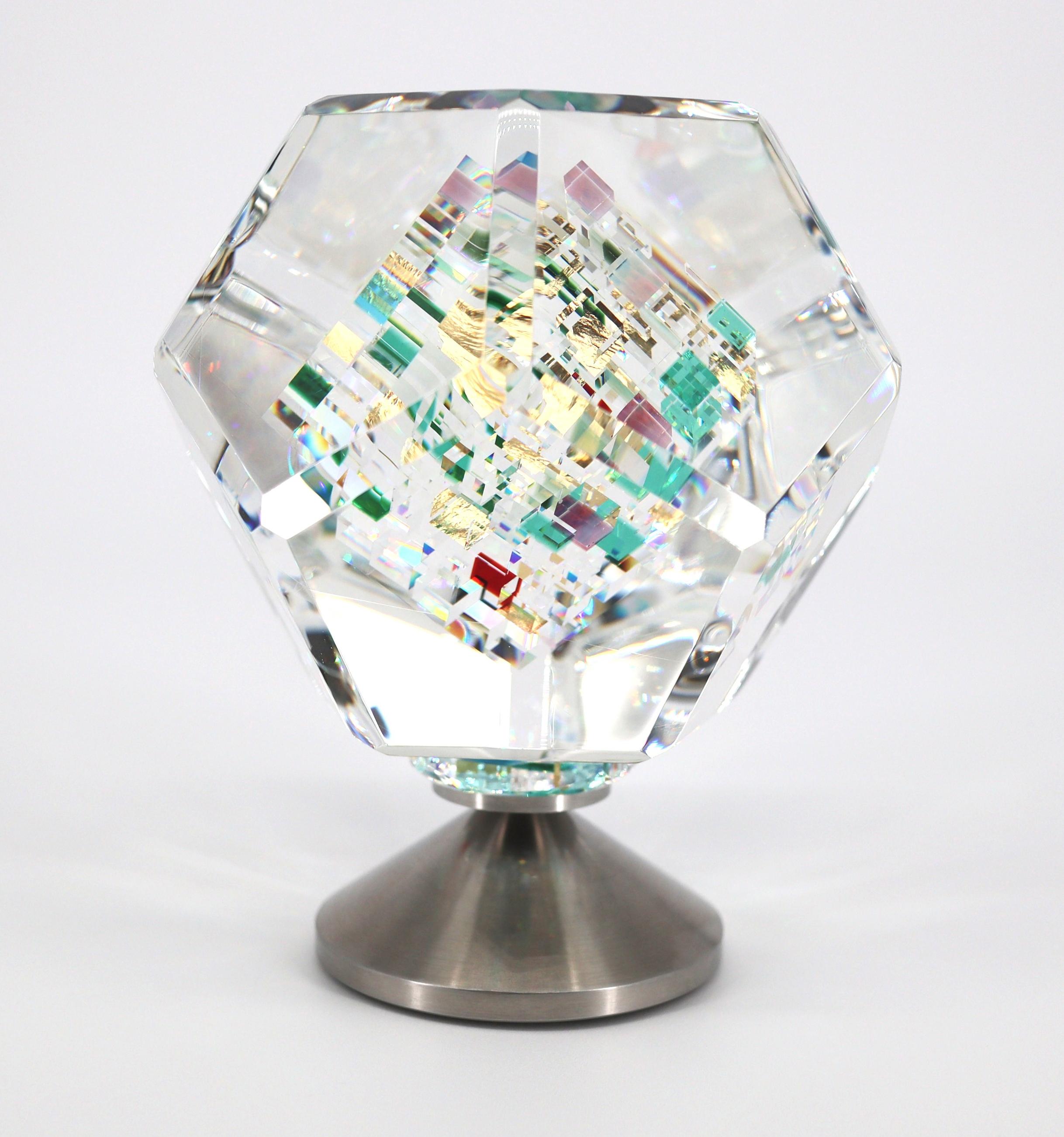 Artist: Jon Kuhn (1949 - Present)
Title: 'Wings of Heat'
Year: 2023
 Origin: Kernersville, North Carolina
Medium: 12 sided Glass Dodecagon on rotating stainless steel base.
Dimensions-Approximately: 6"x4.5"x4.5"Inches
Condition: Mint
Product