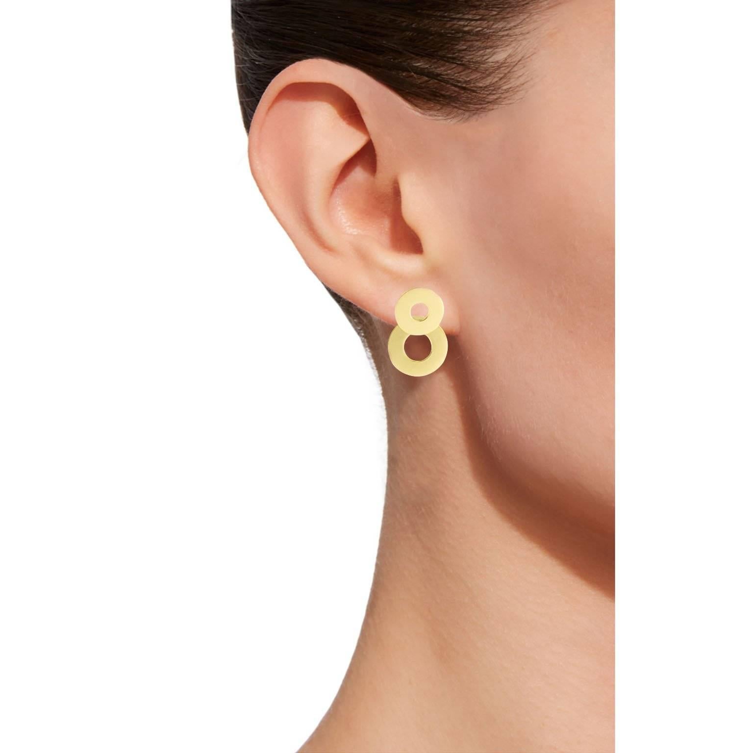 Jona design collection, hand crafted in Italy, 18 karat yellow gold clip-on pendant earrings consisting of two partially overlapping pierced disks.
All Jona jewelry is new and has never been previously owned or worn. Each item will arrive at your