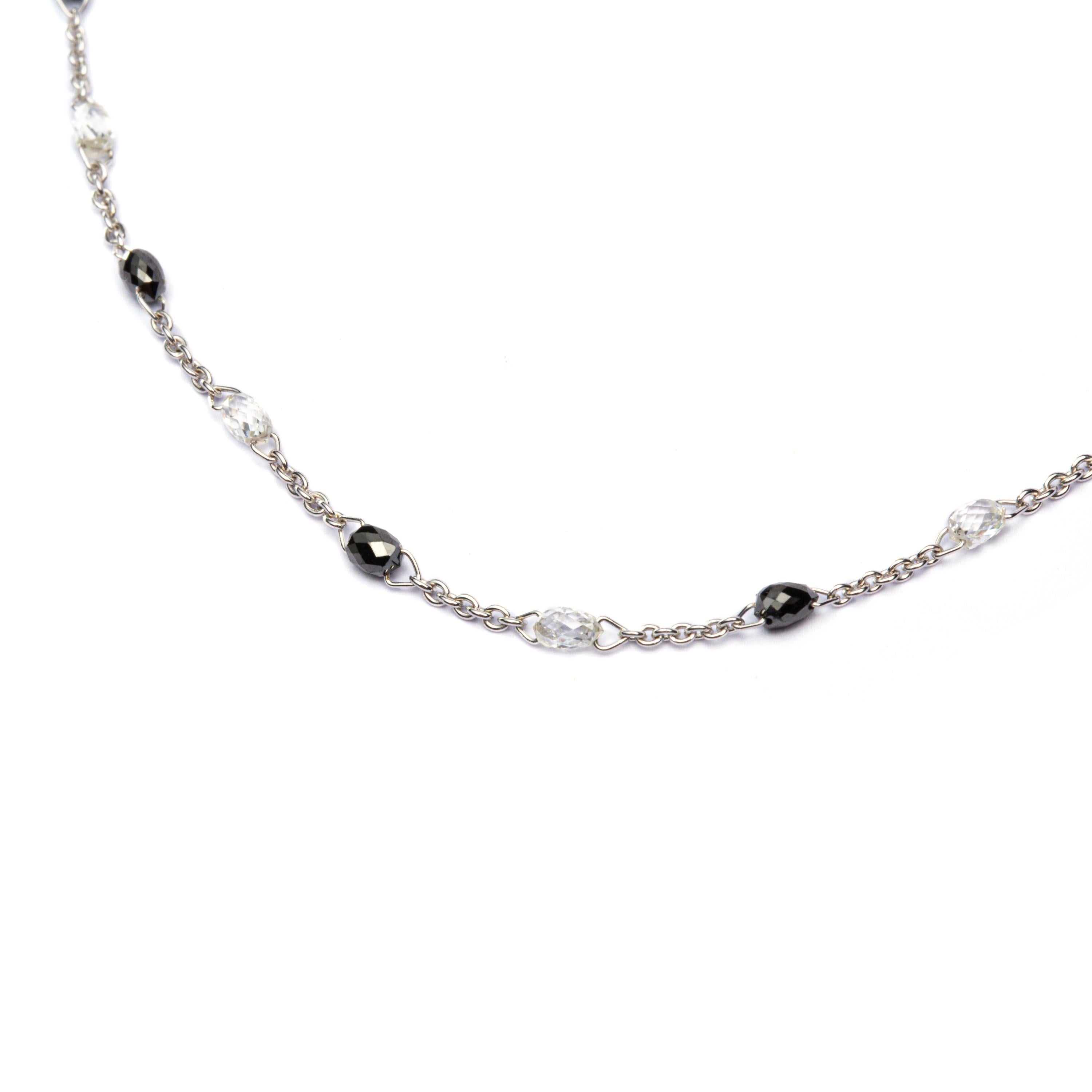Alex Jona design collection, hand crafted in Italy, 18 karat white gold necklace alternating 12 white diamonds briolette cut weighing 1.16 carats, G color, VS2 clarity and 13 black diamonds briolette cut weighing 1.35 carats, G color, VS2 clarity. 