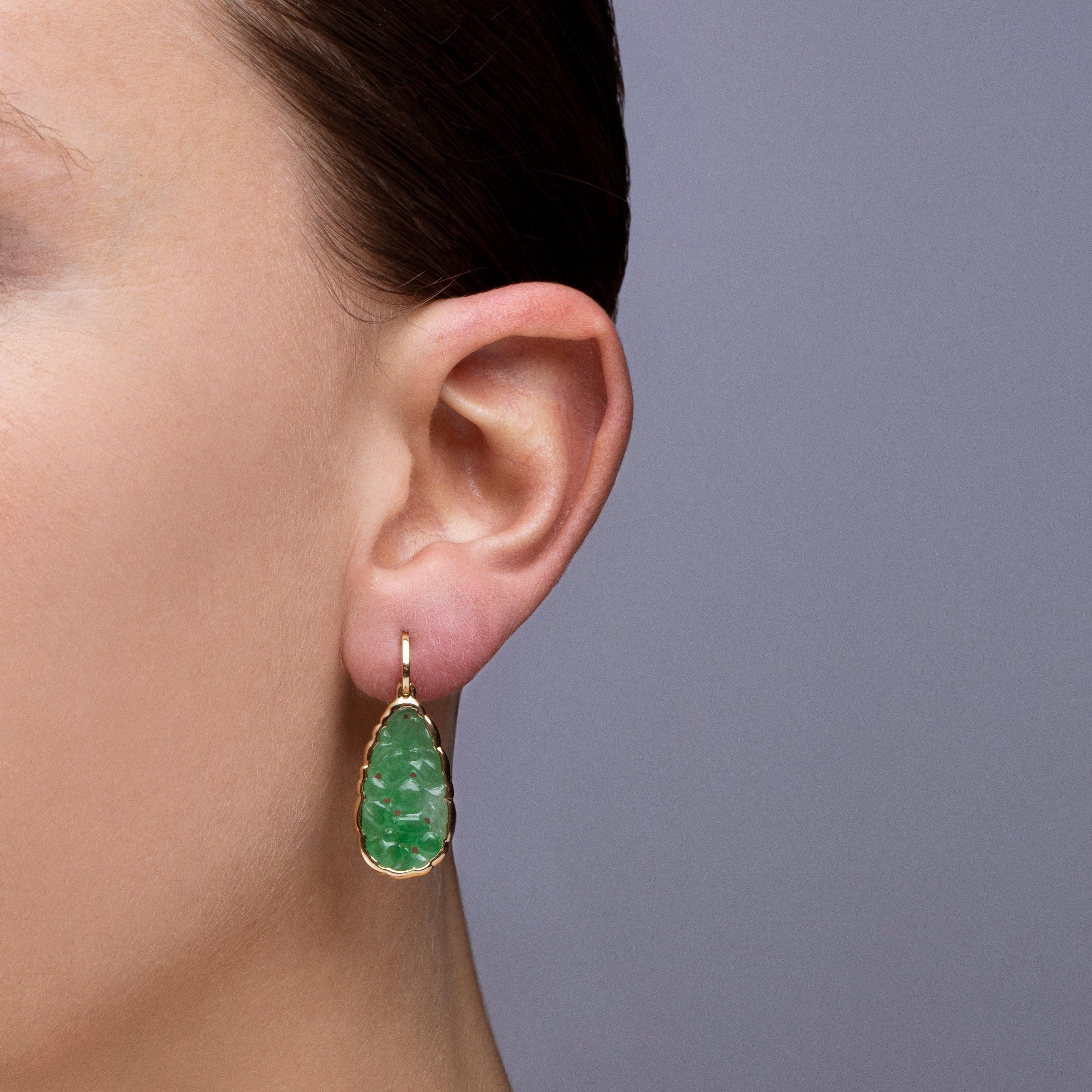 Alex Jona design collection, hand crafted in Italy, 18 karat yellow gold carved burmese jadeite jade pendant earrings weighing 10.96 carats.
Dimensions : H x1.17 in, W 0.46 in. -H x 29.72 mm, W x 11.69 mm. 

Alex Jona jewels stand out, not only for