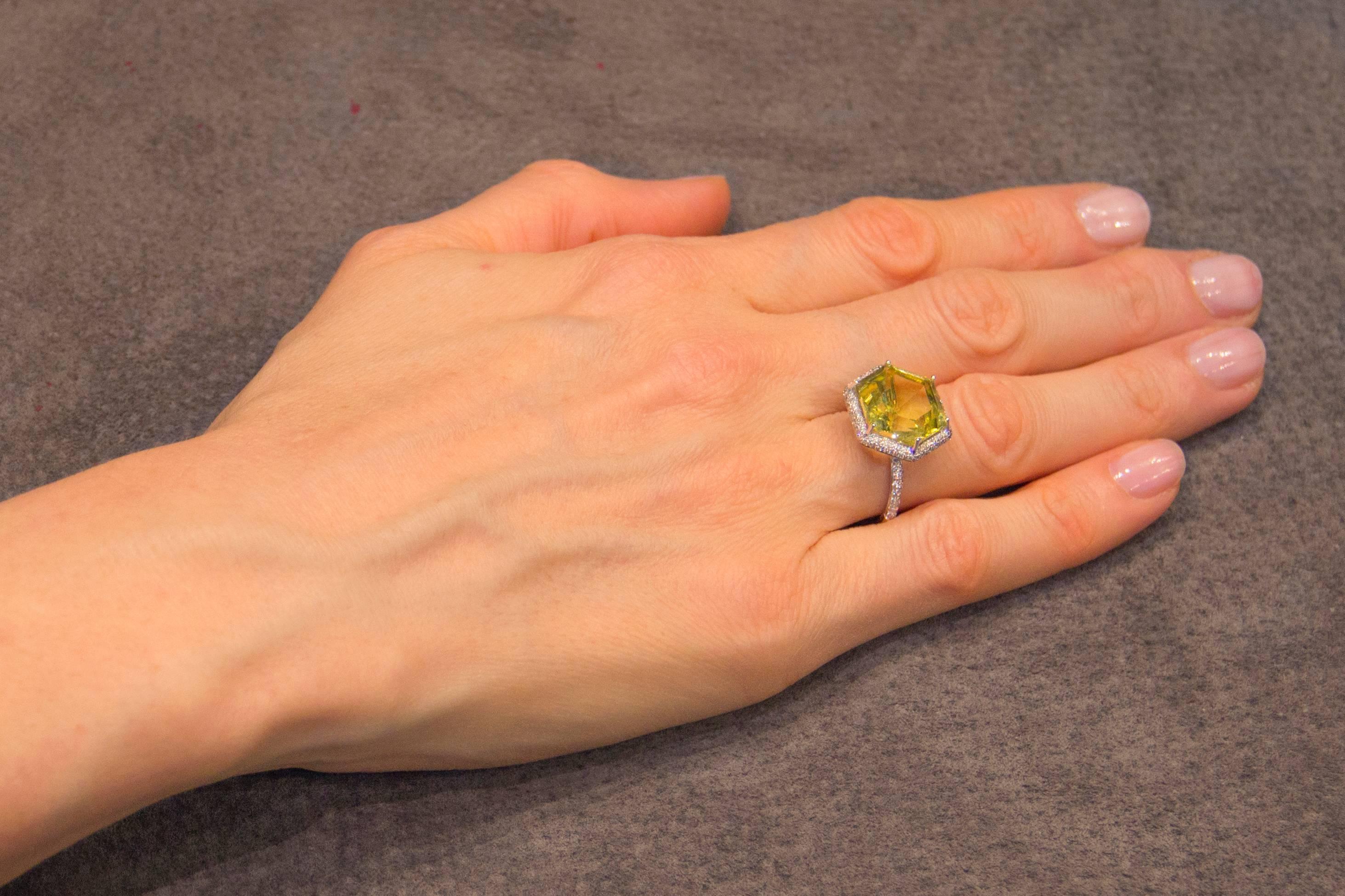 Jona design collection, hand crafted in Italy, 18 karat white gold solitaire ring centering an hexagonal cut citrine weighing 8.72 carats surrounded by a diamond micro pavé halo weighing 0.38 carats. Size US 6.5, can be sized to any