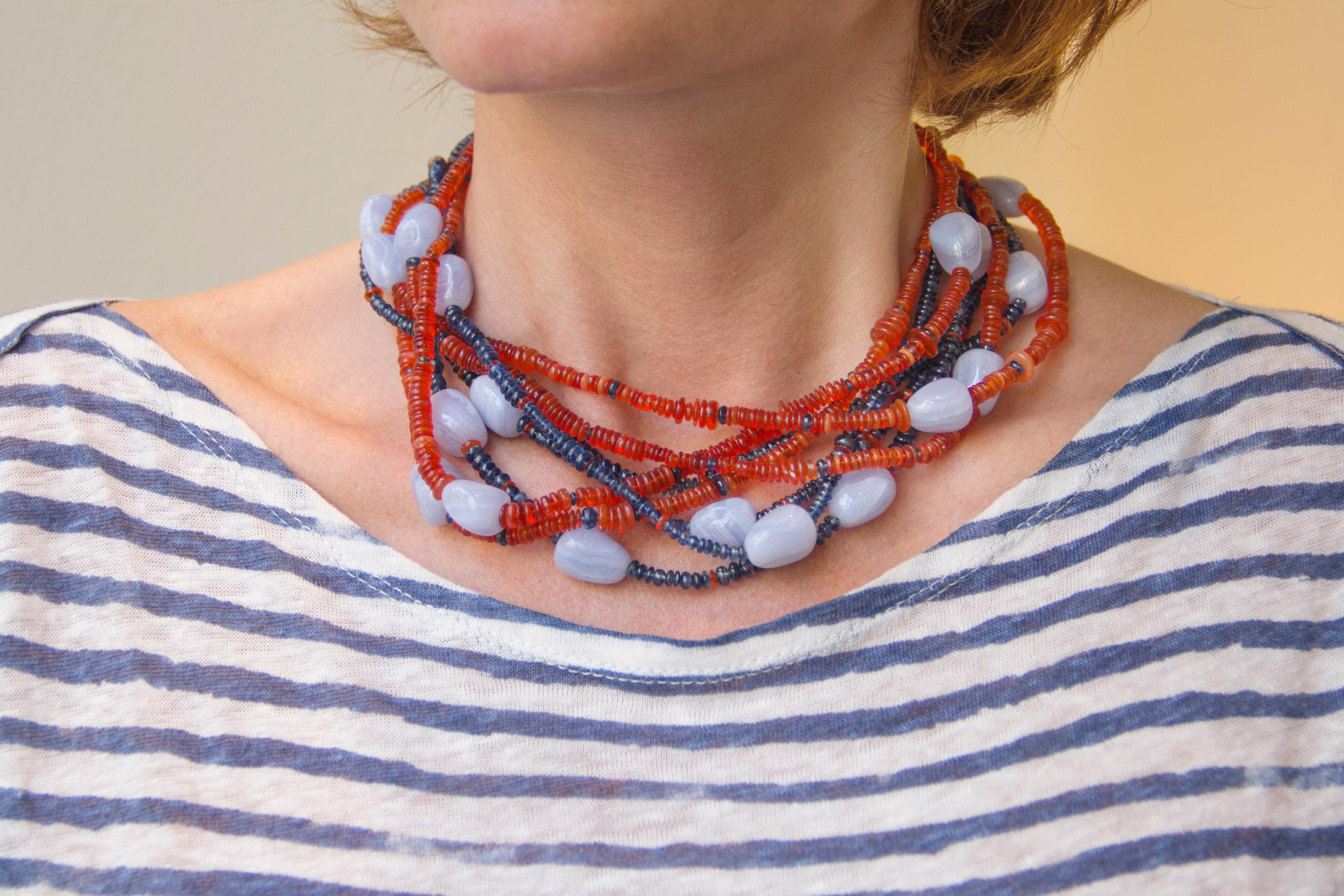 Alex Jona design collection, hand crafted in Italy, 18 karat yellow gold multi-strand necklace, featuring 191 carats of fire opal, 230 carats of kyanite and 25 pieces of chalcedony.

Alex Jona jewels stand out, not only for their special design and