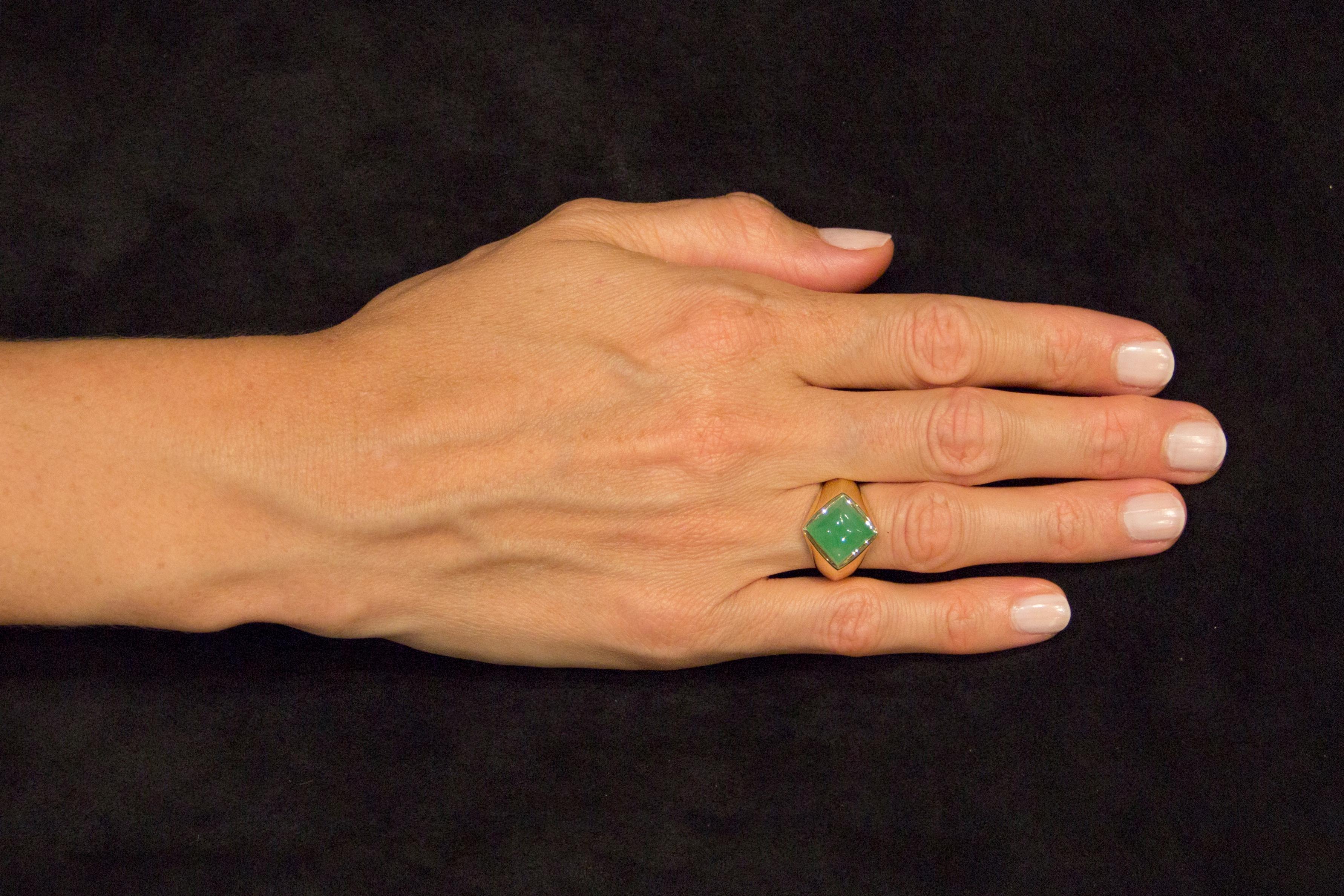 Alex Jona design collection, hand crafted in Italy, 18 karat yellow gold ring set with a sugar loaf Burmese Jade  weighing 4.62 carats. Ring Dimensions:  H 0.97 in x W 0.85 in x D 0.60 in - H 24.8 mm x W 21.6 mm x D 15.2 mm . 
Alex Jona jewels stand