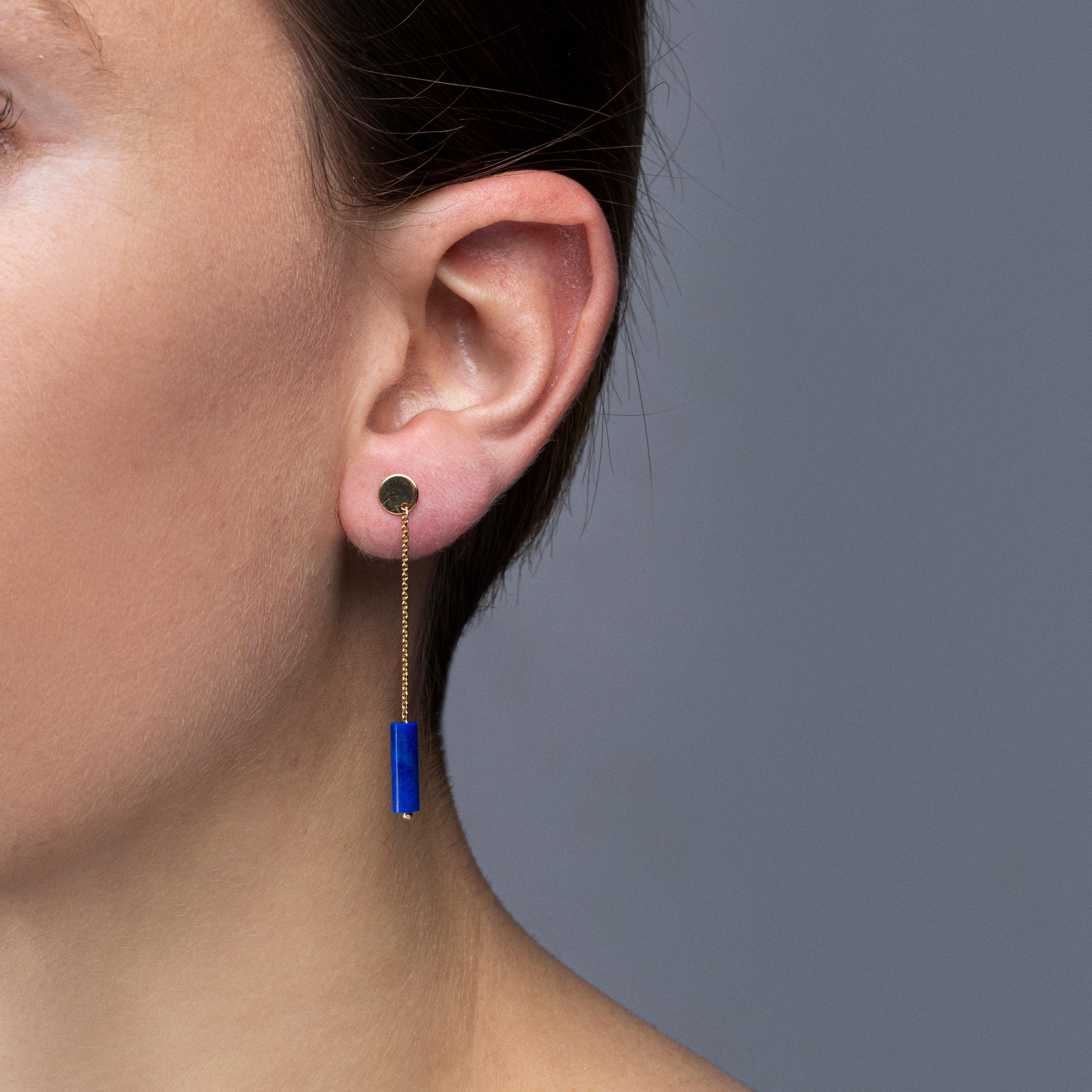 Alex Jona design collection, hand crafted in Italy, 18 karat yellow gold earrings suspending two lapis lazuli cylinders.
Dimensions: H 1.92 in / H 48.90 mm. 

Alex Jona jewels stand out, not only for their special design and for the excellent