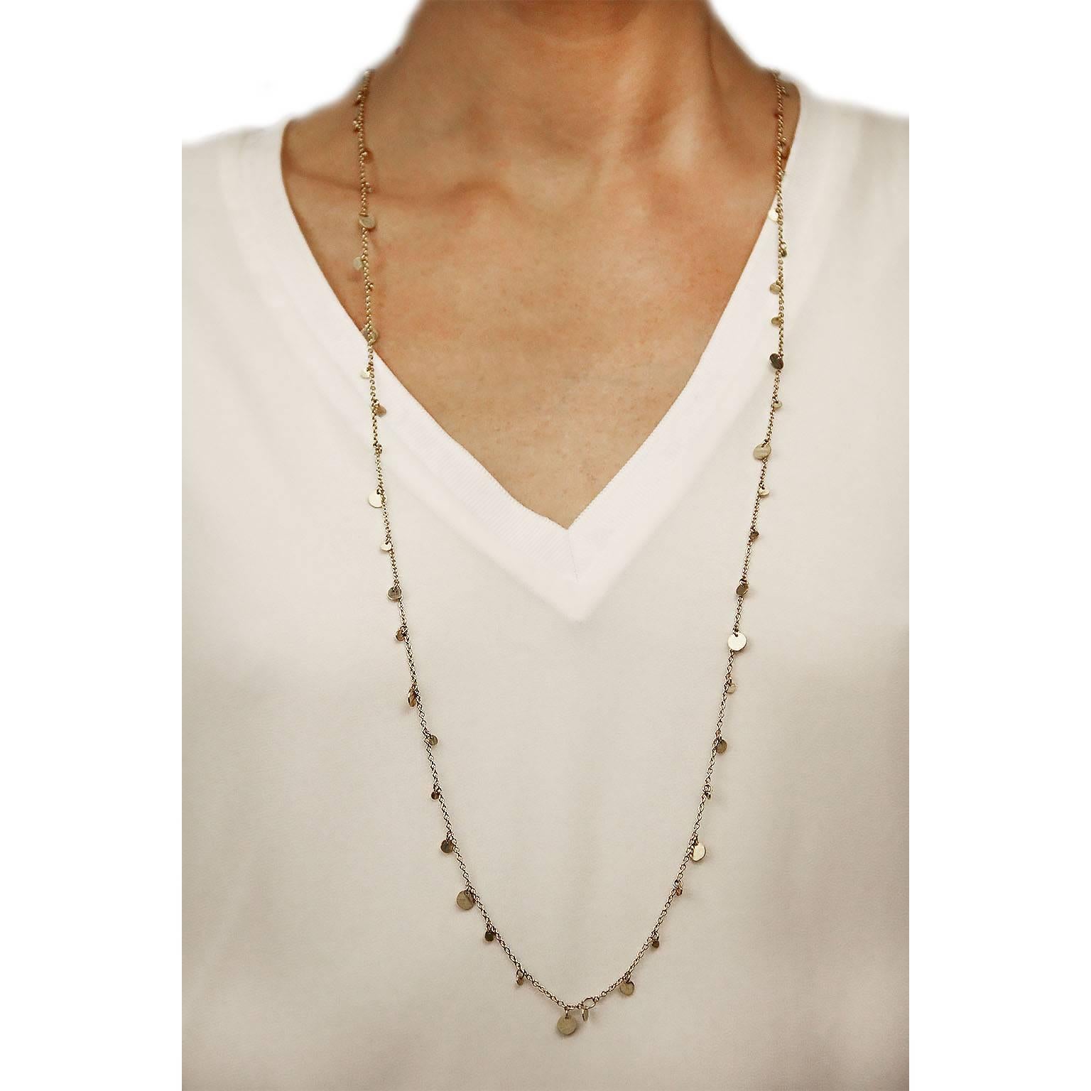 Jona design collection, hand crafted in Italy, 18 karat rose gold long chain sautoir necklace.  A multitude of gold coins in various sizes dangle from the 35.4in-90cm long, chain.  It can also be wrapped around your neck twice for an instant,