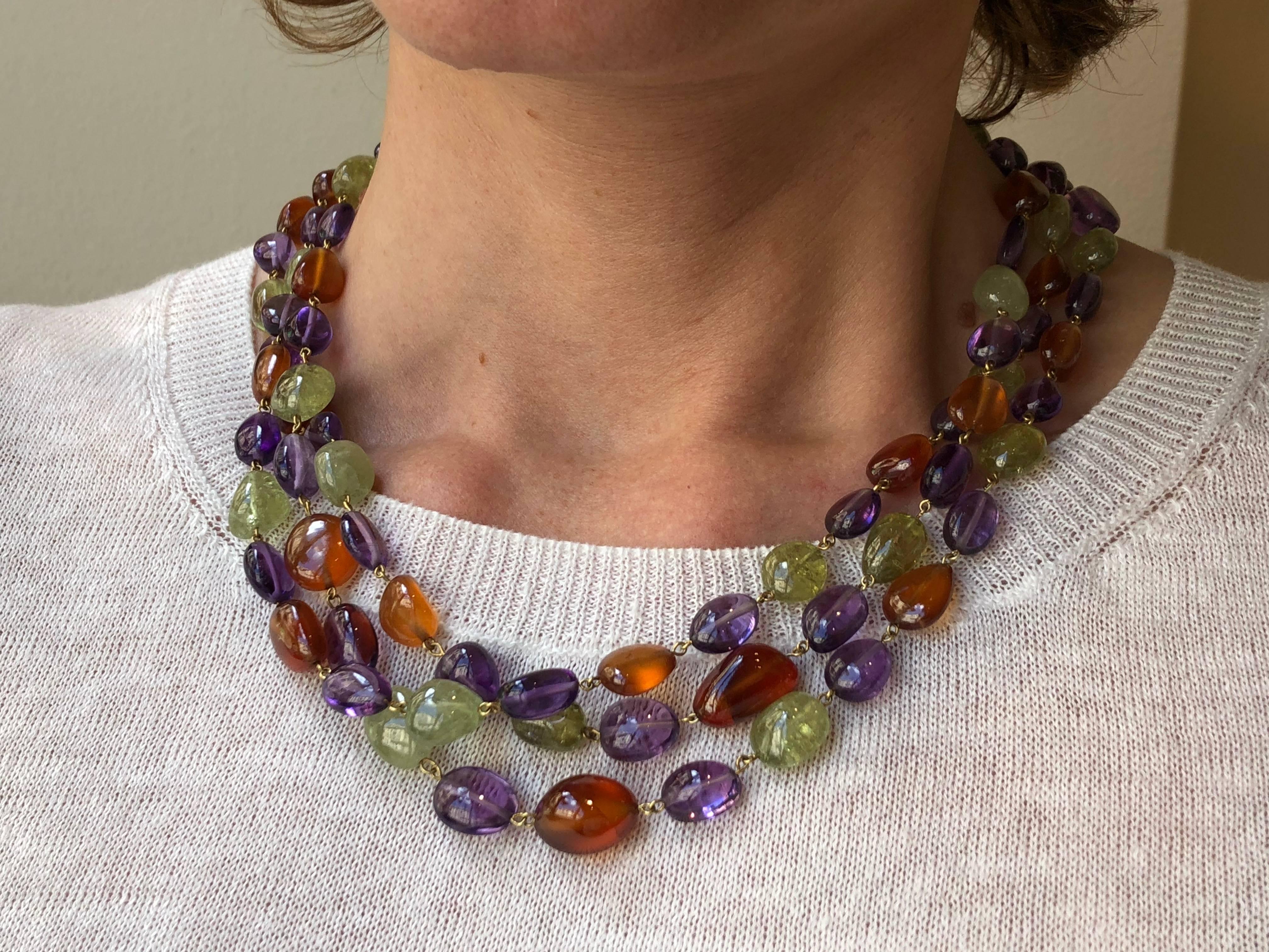 Jona design collection, hand crafted in Italy, 18 karat yellow gold multi-strand necklace, featuring 550 carats of peridots, amethysts and carnelians. Length: 18.5 to 19.3 inch long- 47 to 49 cm long.
All Jona jewelry is new and has never been