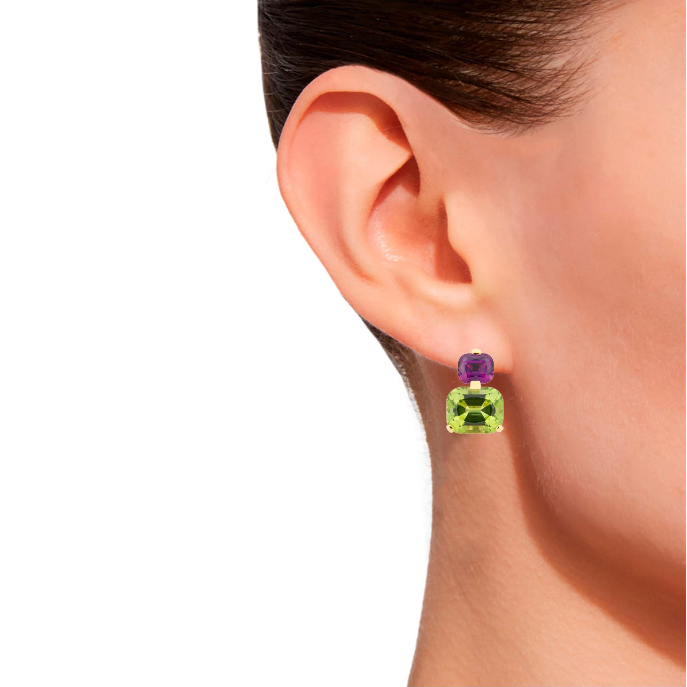 Jona design collection, hand crafted in Italy, 18 karat yellow gold drop clip on earrings set with two cushion cut peridot weighing 9.14 carats and two cushion cut Mozambique purple garnet.
Dimension : H 0.64 in / 16.50 mm X W 0.43 in / 11.04 mm X D