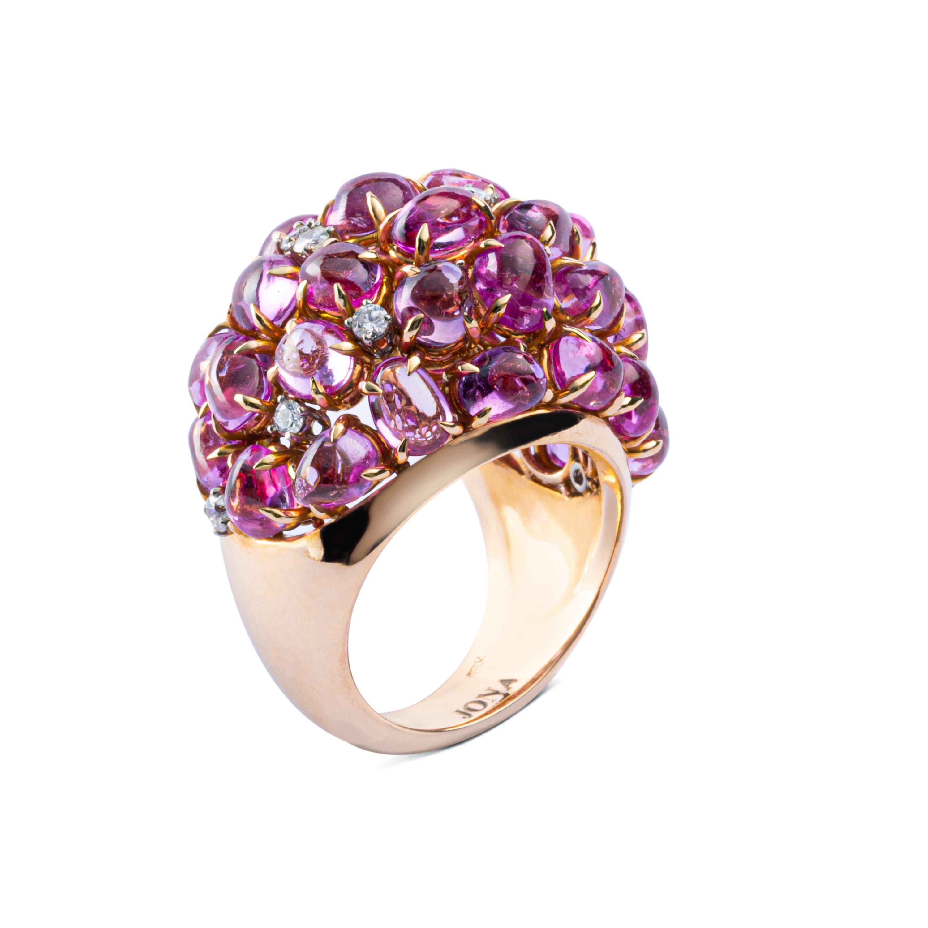 A uniquely hand crafted in Italy dome ring by Alex Jona, featuring 23,02 carats of cabochon cut pink sapphires of multiple shapes and sizes, 0.50 carats of brilliant cut diamonds set in 18K rose gold. Ring size US 6.5- EU 12. Can be sized to any
