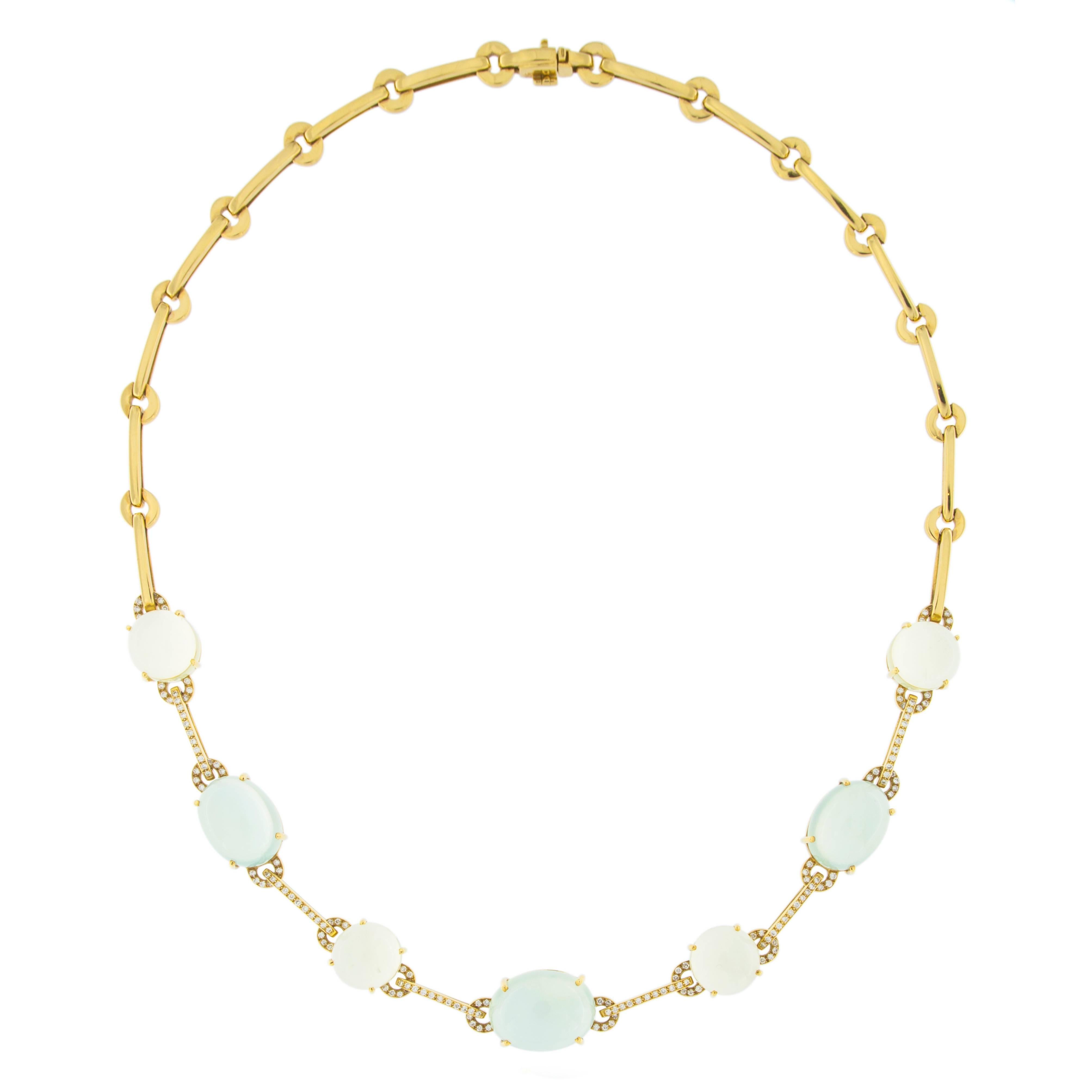 Jona Design collection, 18 karat yellow gold necklace consisting of 3 Prehnite oval cabochons weighing 35.52 carats and 4 round Citrine cabochons weighing 22.46 carats, linked by gold link bars featuring 0.85 carats of white diamonds. Designed and