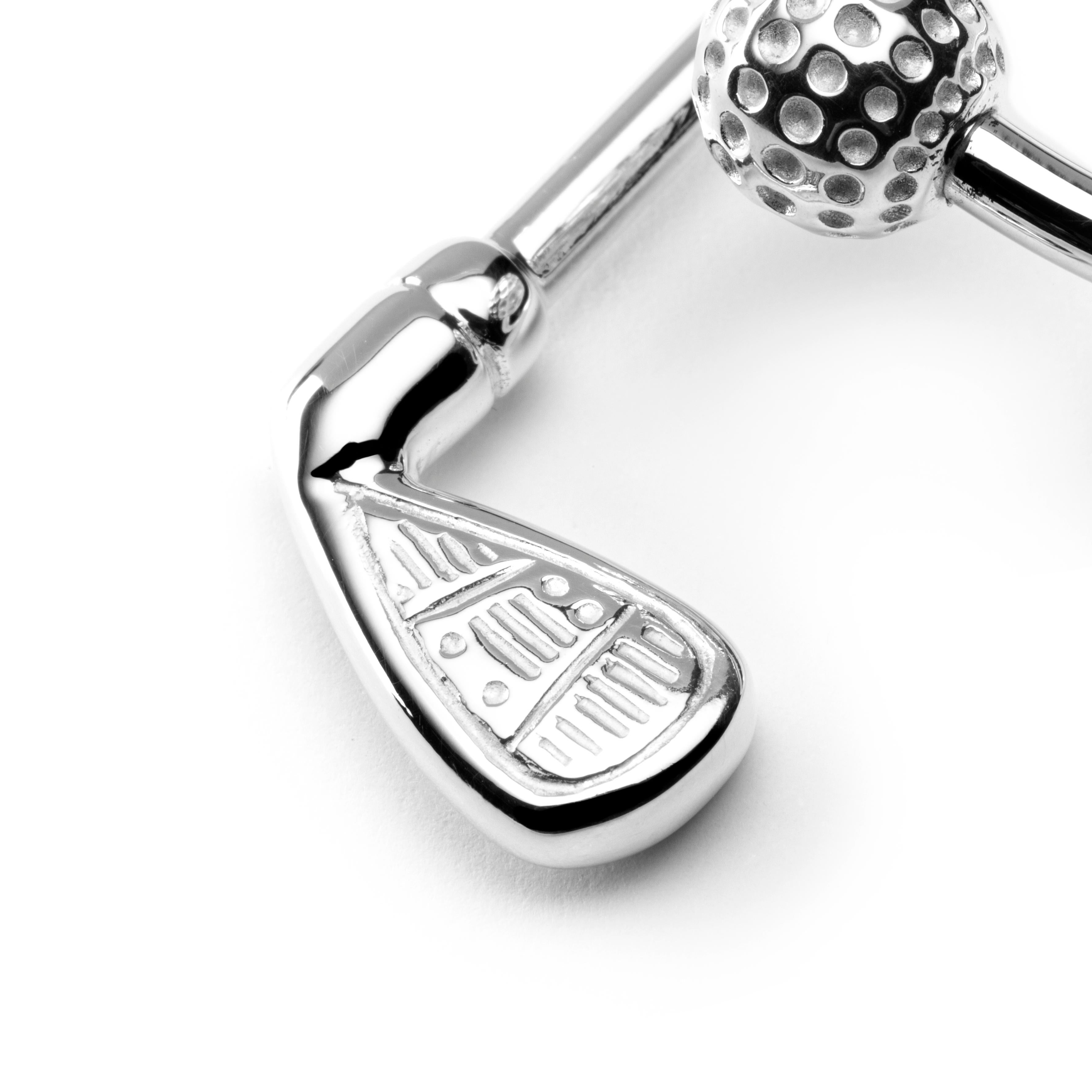 Alex Jona design collection, hand crafted in Italy, rhodium plated sterling silver Ball and Golf-Club key holder.
Dimensions : L x 2 in/ 50.91 mm x W x 1.12 in/ 28.4 mm.

Alex Jona gifts stand out, not only for their special design and for the