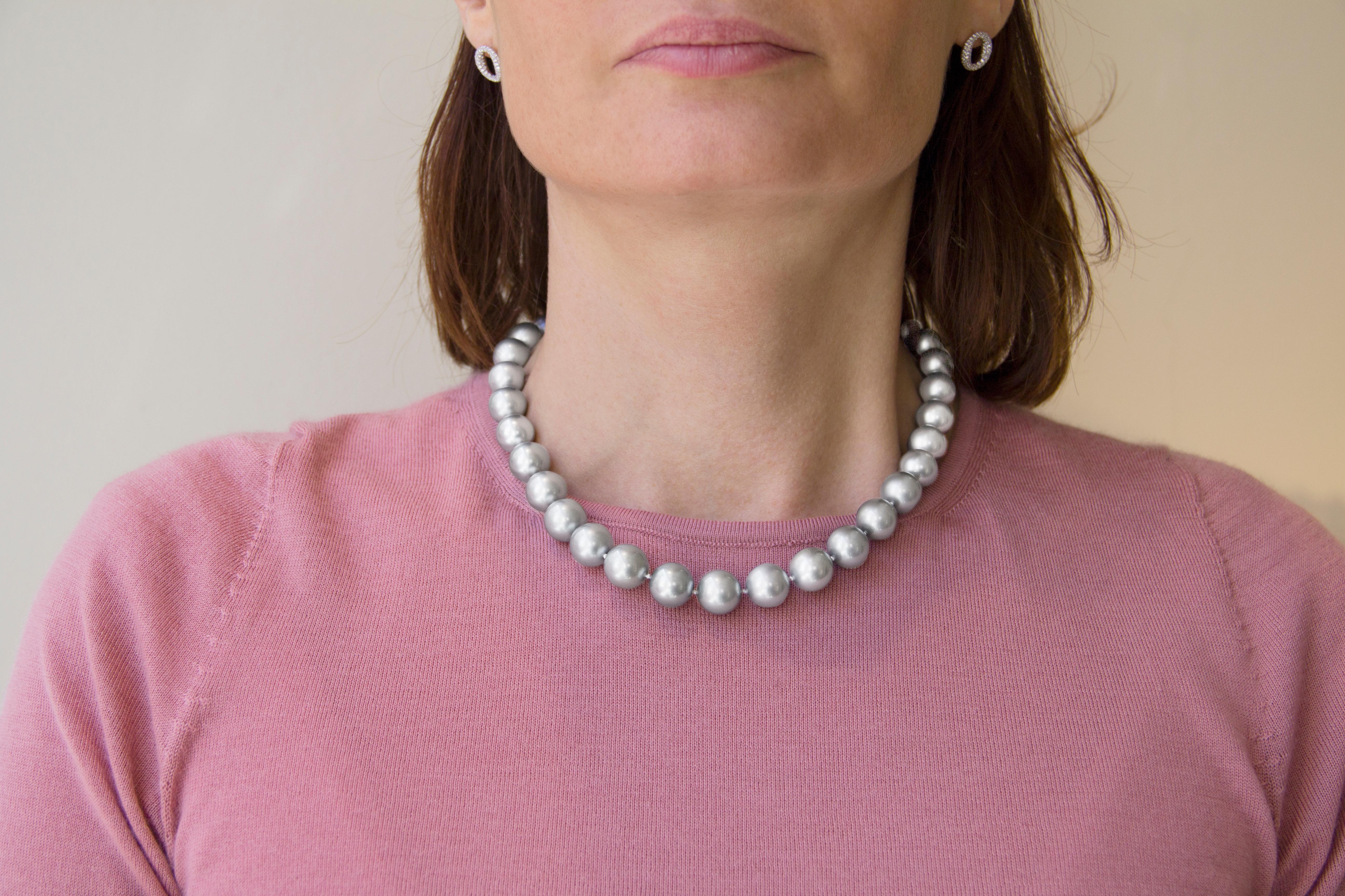 Jona collection, 18.11 inch long necklace consisting of thirty three, 0.49-0.57inch(12.4-14.4mm)diameter, Tahiti light grey pearls, the pearls are strung with an invisible clasps.

Pearl Quality: AA
Pearl Luster: AA

All Jona jewelry is new and has