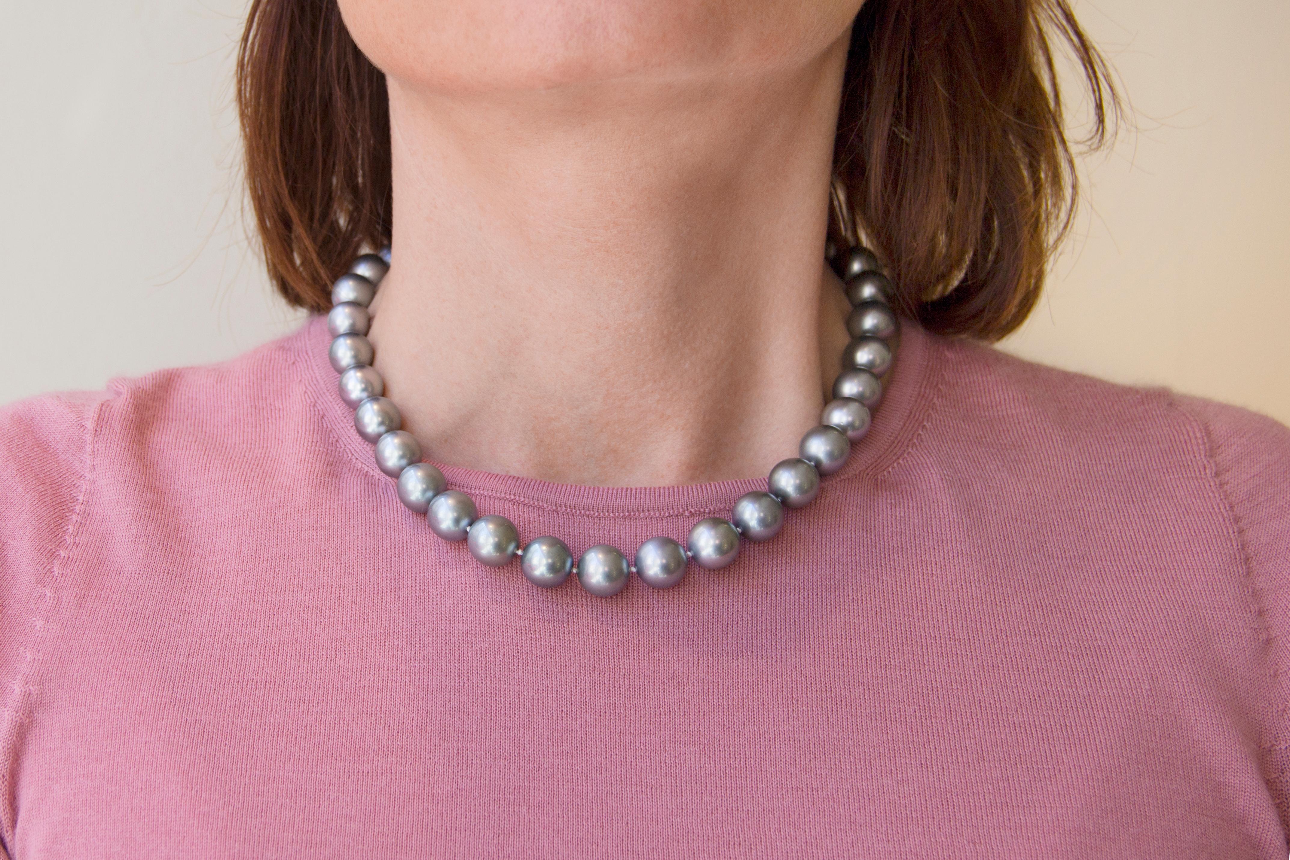 Thirty-five perfectly matched silver pearls from the waters of Tahiti comprise this stunning necklace. Rare among Tahitian black pearls for their light, silvery hue, these gems range in size from 11mm to 12.7mm. Their size, color and eye-catching