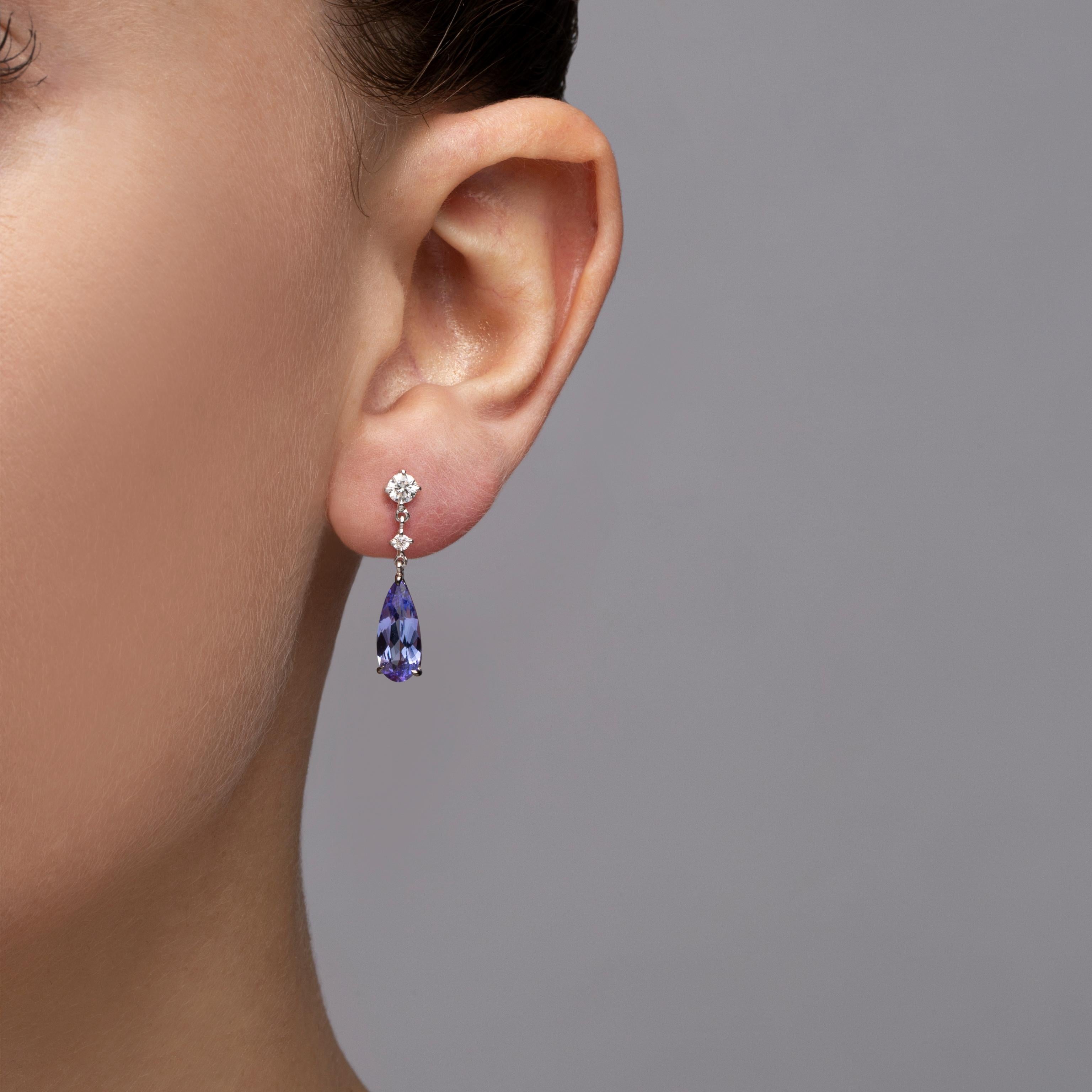 Alex Jona design collection, hand crafted in Italy, 18 karat white gold drop earrings set with 2 drop cut Tanzanite weighing 3.65 carats and 0.47 carats of White Diamonds, F color, VVS1 clarity.
Dimensions: 1.02 in. H x 0.22 in. W x 0.14 in. D. - 