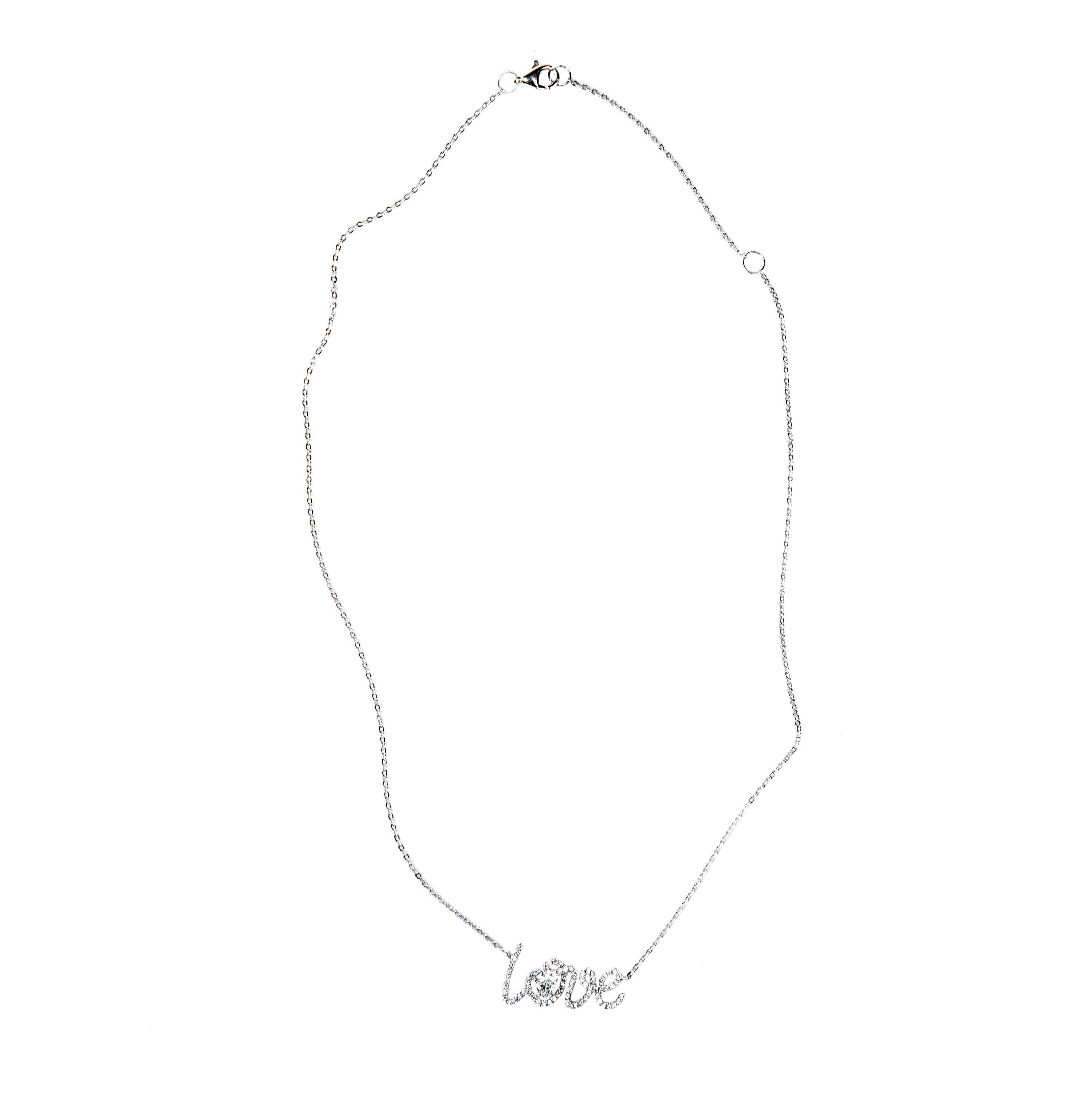 Jona design collection, hand crafted in Italy, 18 karat white gold necklace, 15.35 inch long suspending a LOVE pendant,  centering a heart shape diamond and set with round white diamonds, F Color, VVS1 Clarity, for a total weight of 0.42 carats.