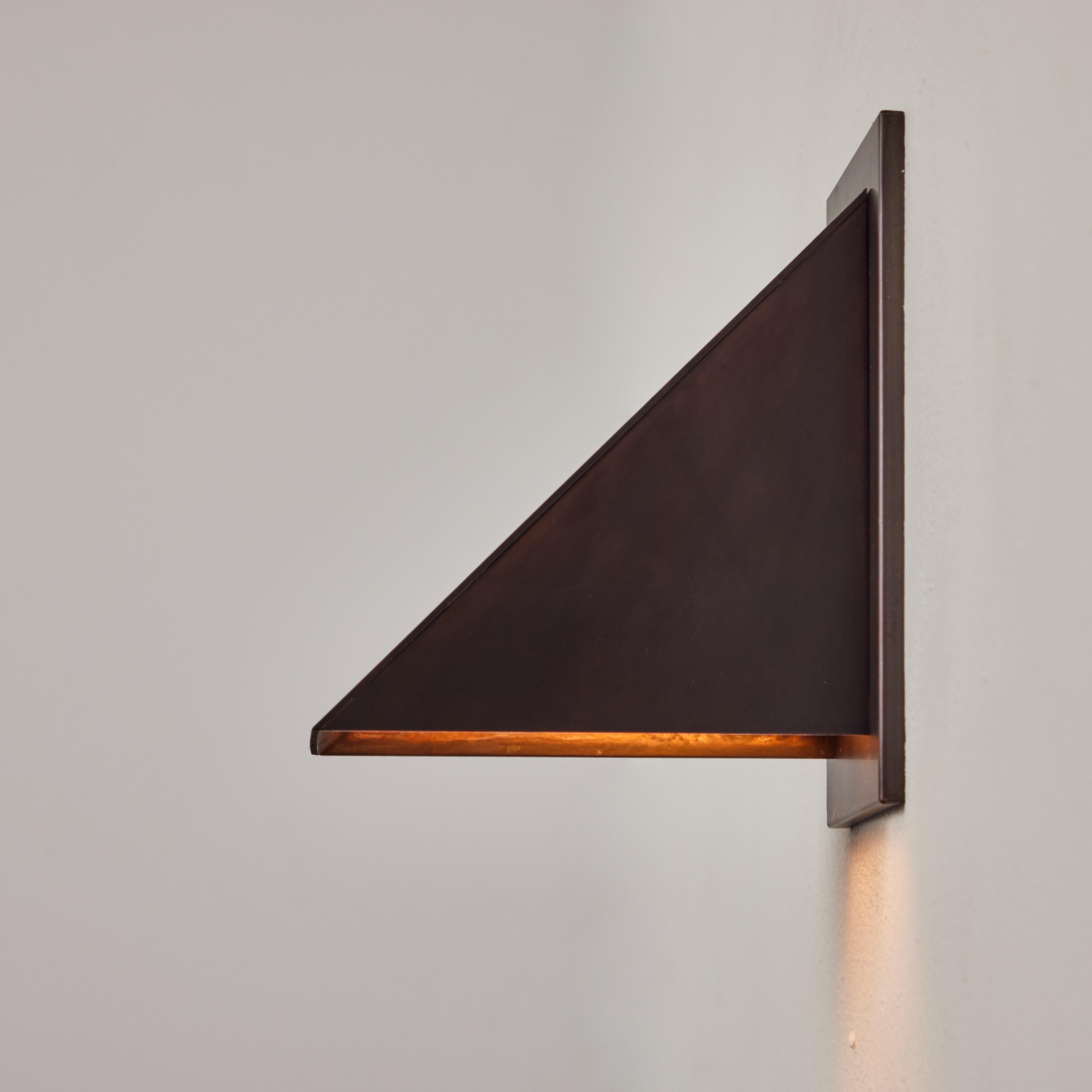Jonas Bohlin 'Oxid' Dark Brown Patinated Outdoor Wall Light for Örsjö. Executed in richly patinated metal with an opaline glass diffuser. An incredibly refined and clean geometric design that is quintessentially Scandinavian. For indoor or outdoor