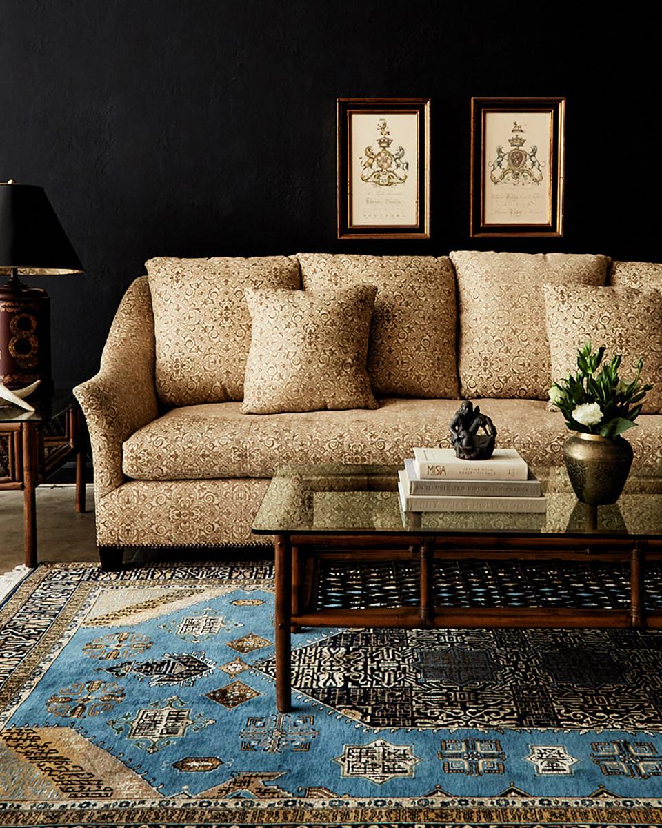 Grand four seat upholstered sofa by Jonas of New York City. This bespoke sofa features an artisan made hardwood maple frame with dramatic sculptural style serpentine arms and back that flare out on the ends. Upholstered with an arabesque geometric