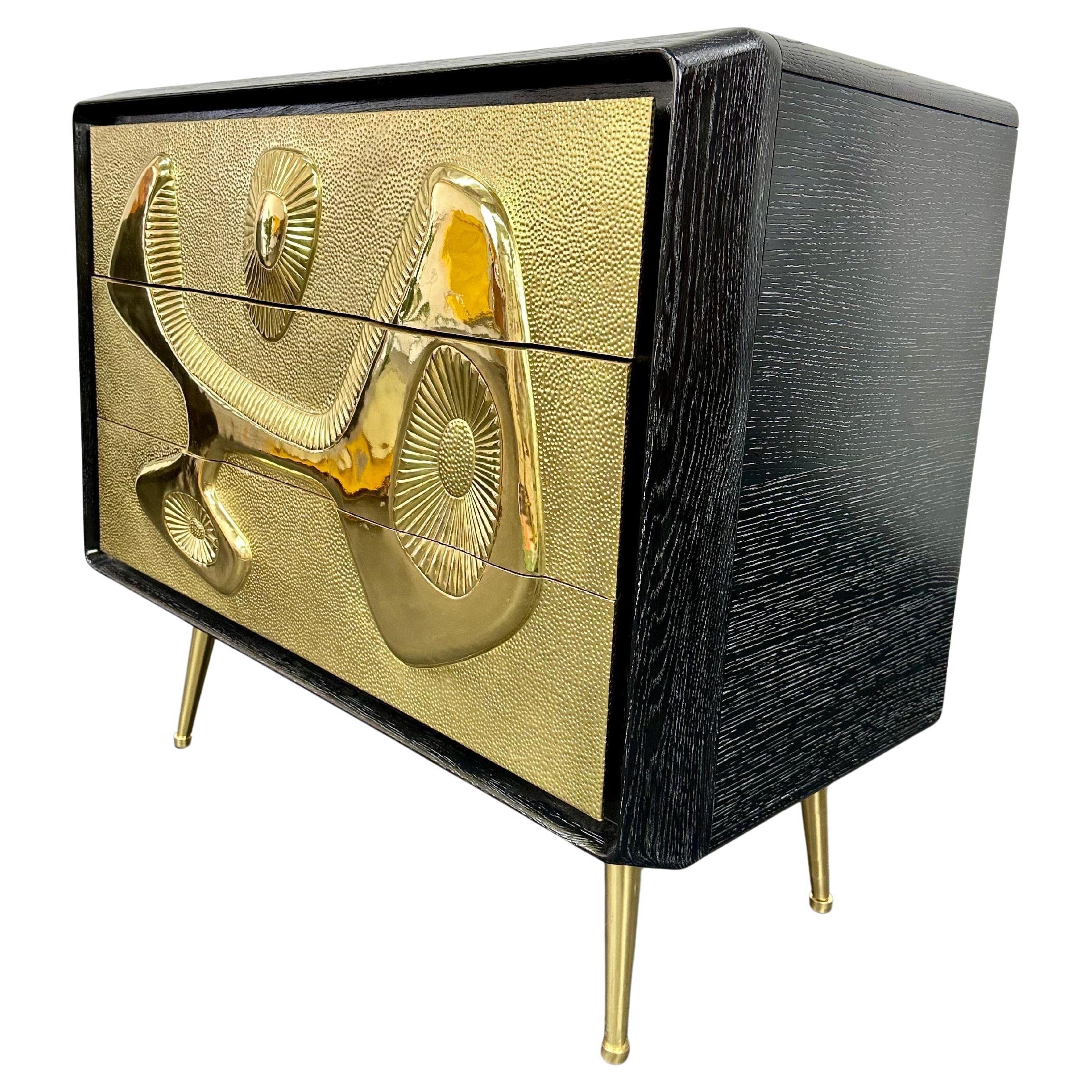 Current production Jonathan Adler 3 drawer dresser from the “Reform” line. An ebonized and limed oak cabinet with drawer faces featuring the signature Reform design—a relief texture originally sculpted in Adler’s Soho pottery studio—clad in a sheet