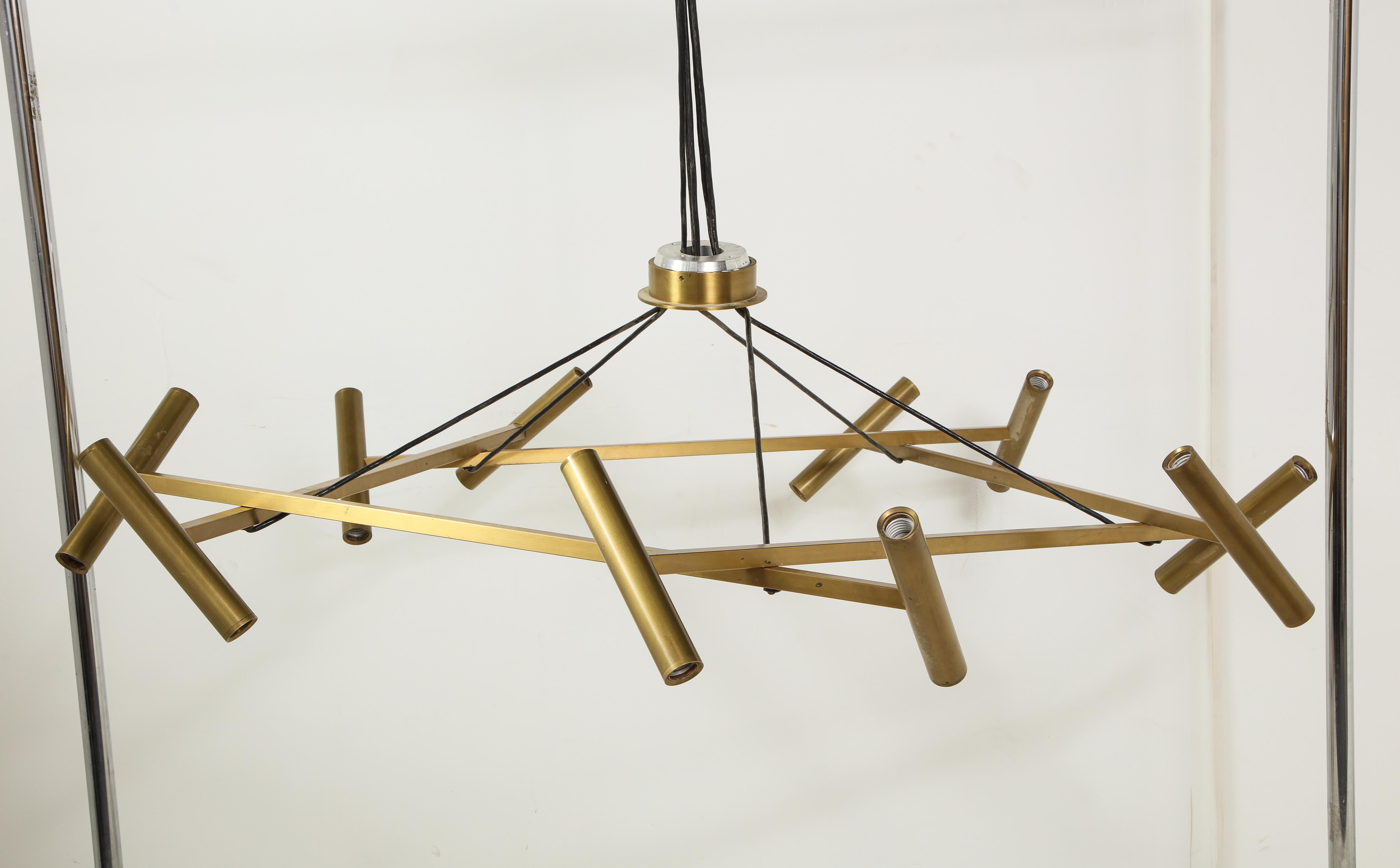 Jonathan Browning Le Pentagone brass tubular chandelier in very good condition. The five square tubes terminate at each end at a round tube which is offset at various angles. Each round tube terminates with a frosted tubular bulb. No bulbs with this