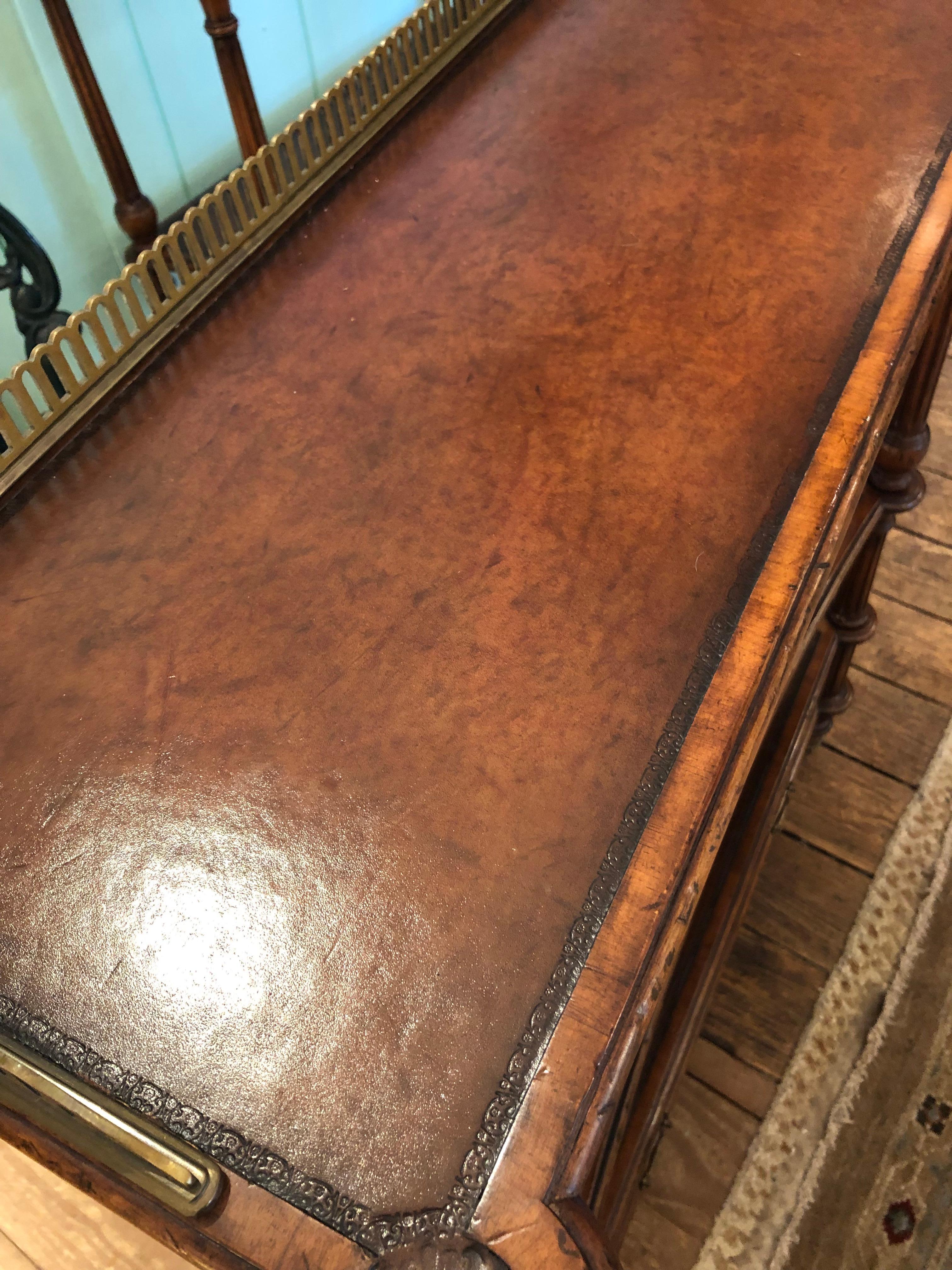 Great looking pair of versatile burlwood and embossed leather etageres or shelves having bottom drawer and 2 shelves with pierced brass upper gallery.
38.5 h to gallery top  37 h to top surface
Bottom shelf 12