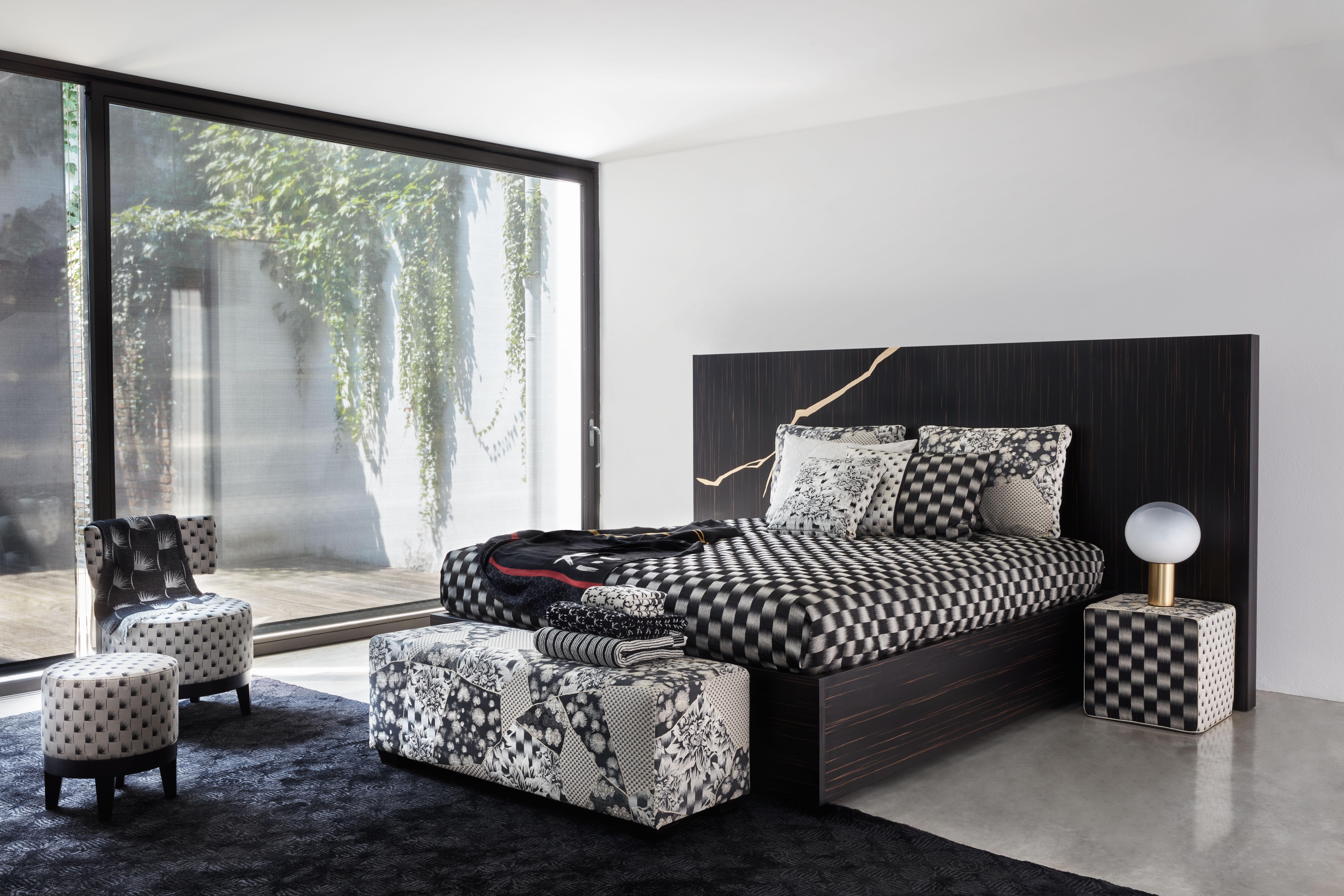 Distinguished by a remarkable, large headboard featuring a kintsugi, one of K3's signature motifs inspired by the Japanese art of preparing broken pottery, this bed is an iconic design. Crafted from plywood, wood fibre, and steel, the sleek