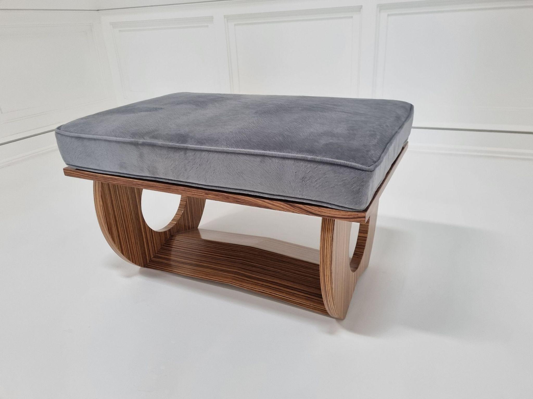 Aubury Zebrawood bench by Jonathan Franc - the rectangular 4 inch cushion over a conforming seat, supported by two shaped legs connected by a raising stretcher. Fabric: 2 yards, COM.