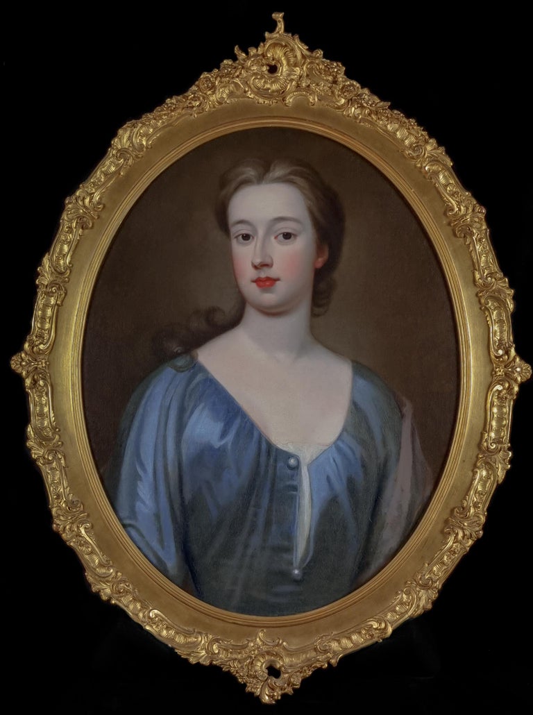 These beautiful portraits were painted circa 1725 and are fine examples of the English eighteenth century portrait style.  One sitter has been depicted wearing a simple blue silk dress and the other wears a red silk dress and a silk drapery in her